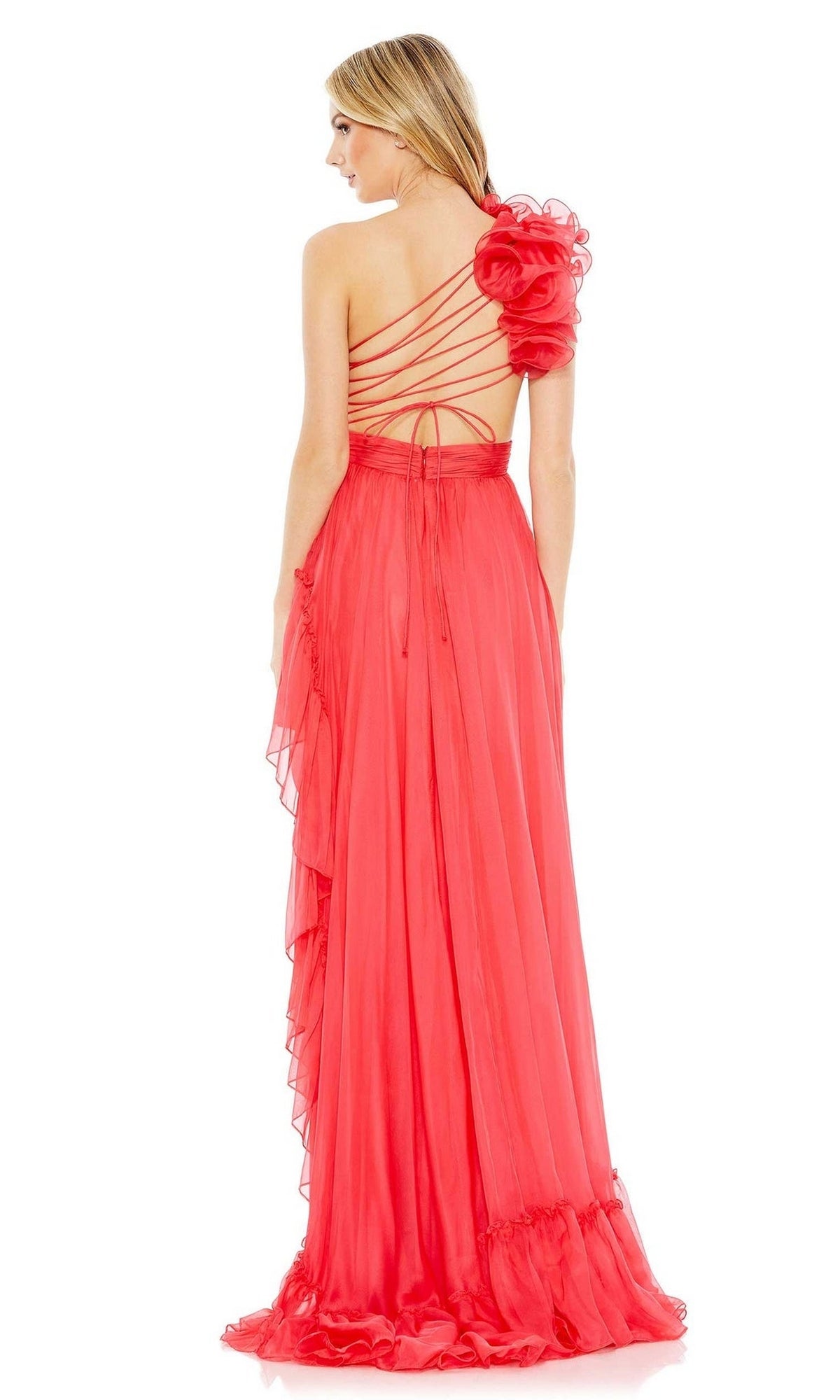 A woman is shown from the back wearing the Long Formal Dress 67989 by Mac Duggal, featuring a flowing red one-shoulder design with spaghetti straps and a large floral detail on the shoulder.