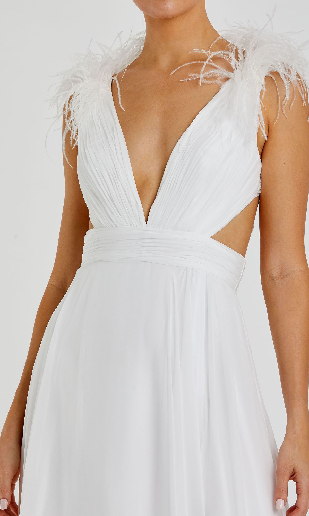 A woman wearing the Mac Duggal 68113 Feather-Trim Long Formal Dress in white, with a sleeveless design, deep V-neckline, feathered shoulders, and a gathered waistband.