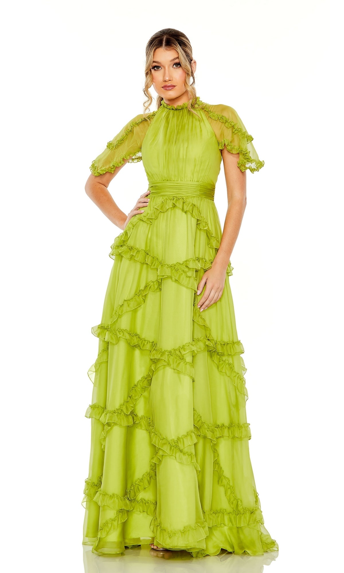 A woman models the Mac Duggal Long Formal Dress 68222 in apple green, a floor-length A-line with ruffles, short puff sleeves, and a high neckline, set against a plain white background.