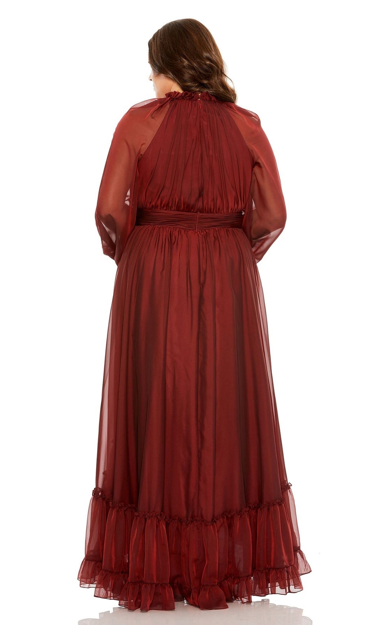 A woman is seen from the back wearing the Long Plus-Size Prom Dress 68434 by Mac Duggal, featuring a burgundy hue, elegant puff sleeves, sheer accents, and a ruffle hem, set against a white background.