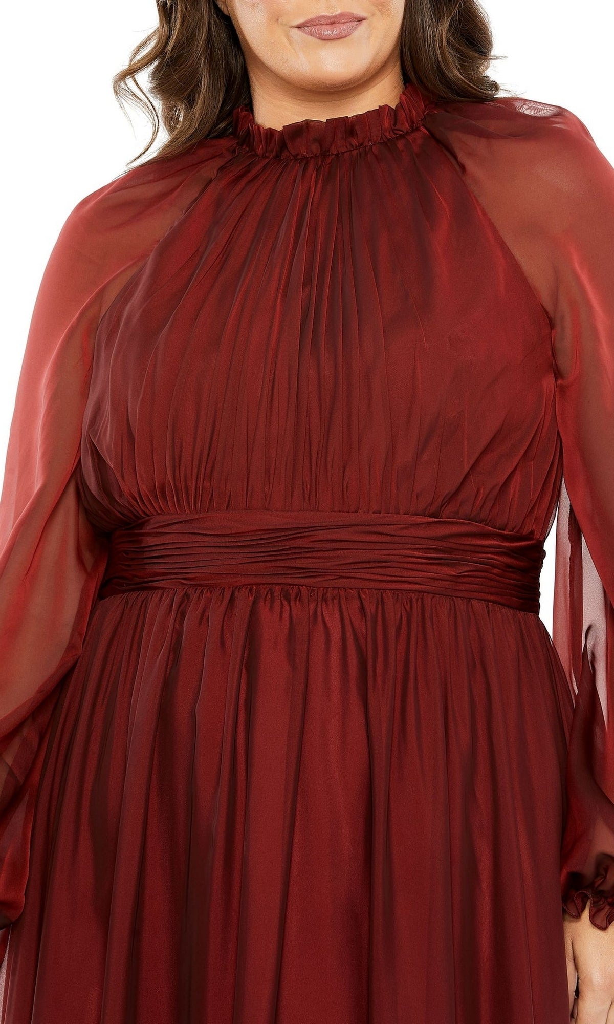 A person wearing the Long Plus-Size Prom Dress 68434 by Mac Duggal—a burgundy chiffon formal gown with long sleeves, a high neck, fitted waistband, and pleated bodice.