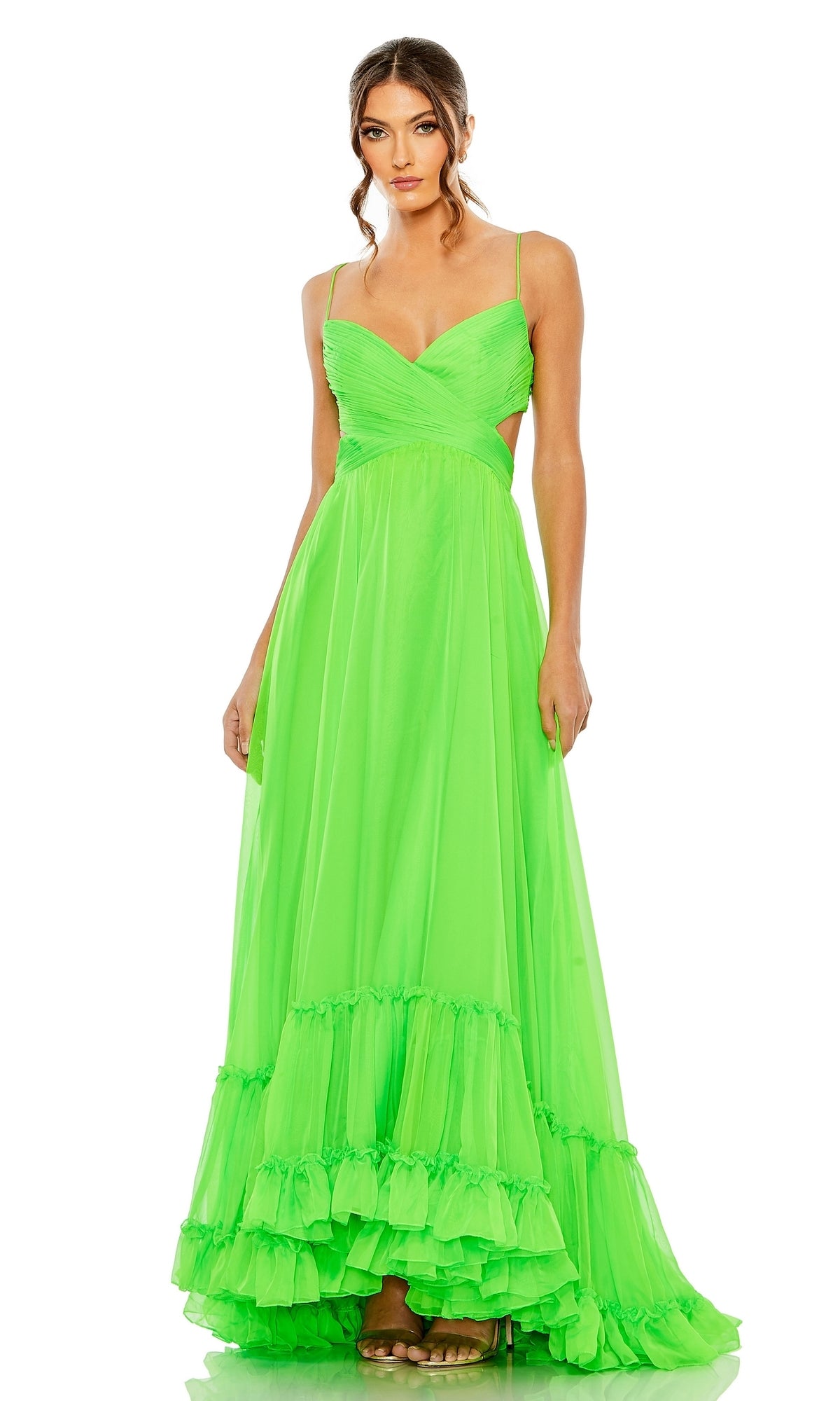 Woman wearing the Long Formal Dress 68477 by Mac Duggal, featuring neon color, ruffle details, a fitted bodice with cutout sides, and a flowing skirt, standing against a white background.