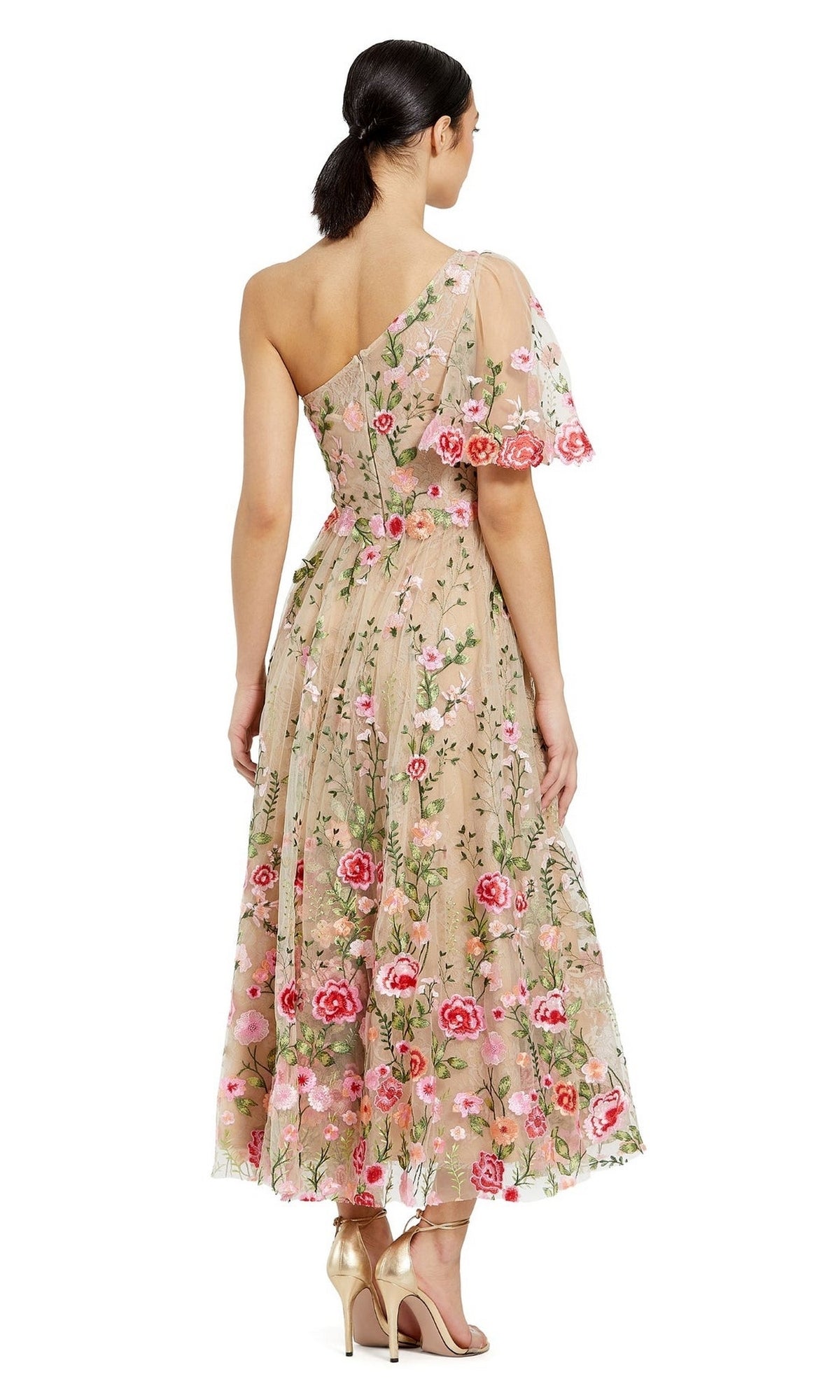 Woman in the Mac Duggal 68607 One-Shoulder Midi Party Dress—beige, tea-length, with pink and red floral embroidery—stands in heels, facing away.