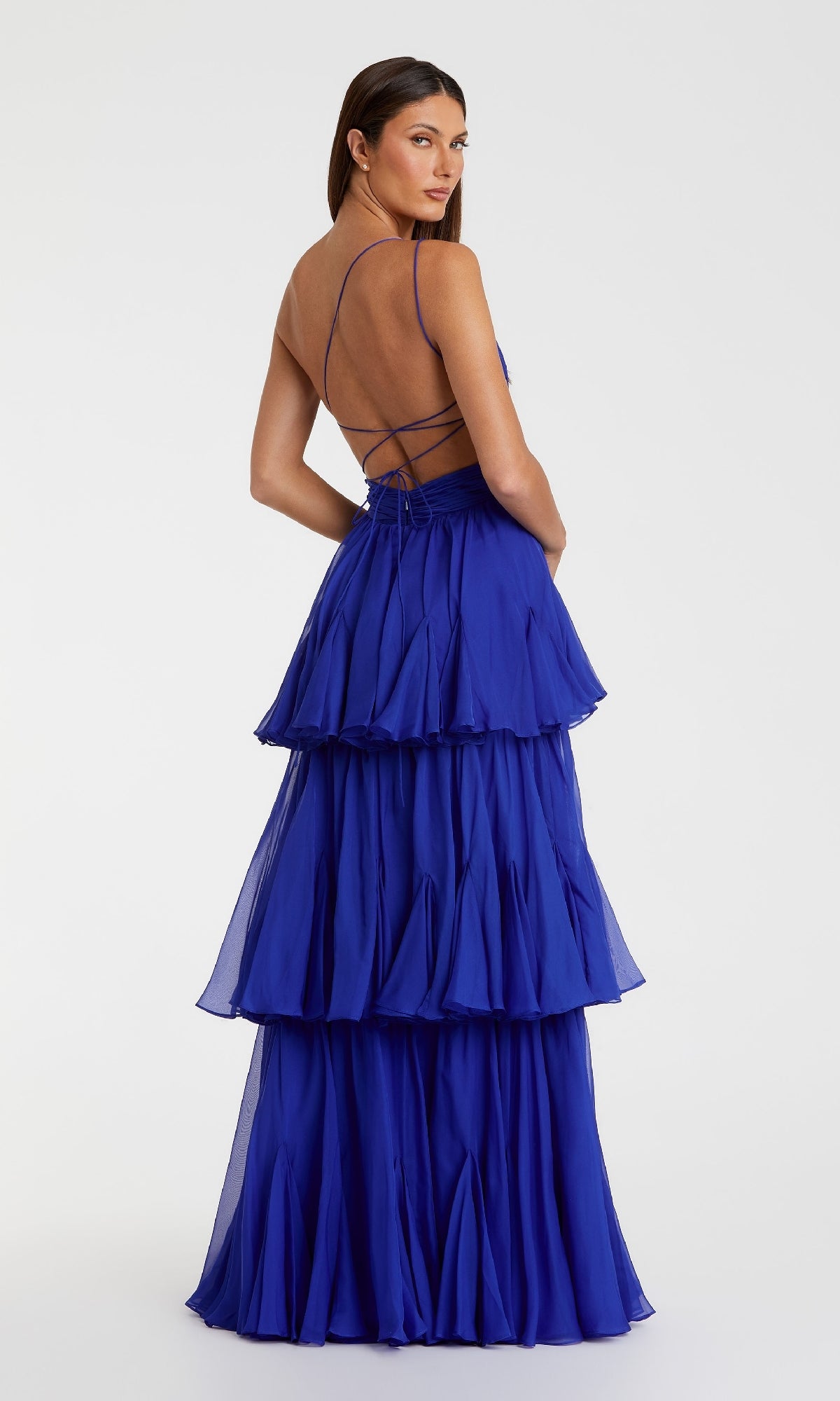 Woman modeling the Mac Duggal 68846 One-Shoulder Blue Formal Dress, shown from behind against a plain background.