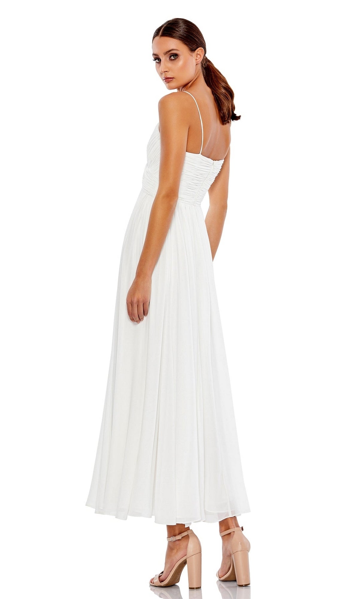 Woman in profile wearing the Mac Duggal 70099 A-Line Midi Wedding Guest Dress, a white sleeveless dress with spaghetti straps and ruched bodice, styled with nude high-heeled sandals.