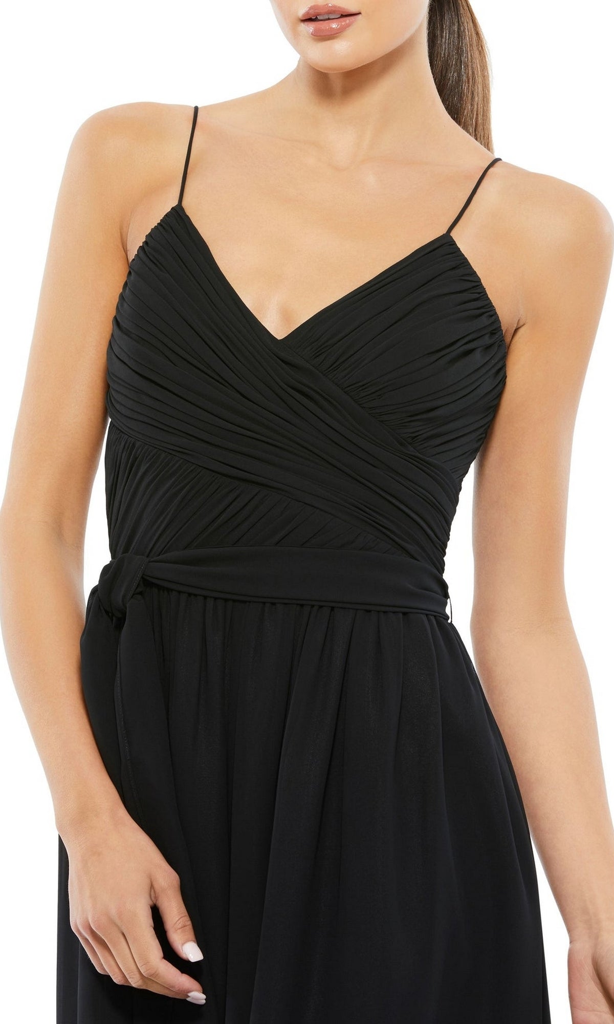 A woman wears the Flowing Wide-Leg Formal Jumpsuit: Mac Duggal 70100—a sleeveless black jumpsuit with thin straps, V-neckline, ruched bodice, tied waist, and wide legs—ideal as a modern prom look.