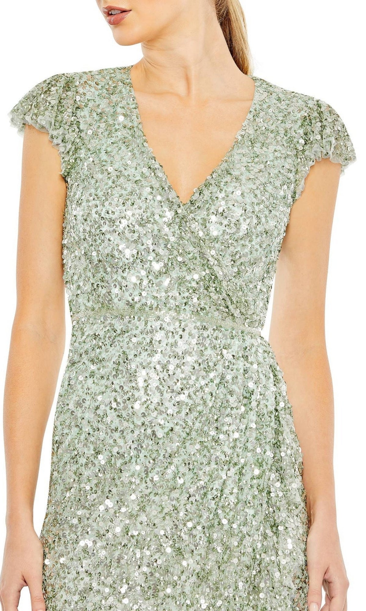 Woman wearing the Long Formal Dress 70113 by Mac Duggal in light green sequins, featuring cap sleeves and a v-neckline; shown from shoulders to above the knees.