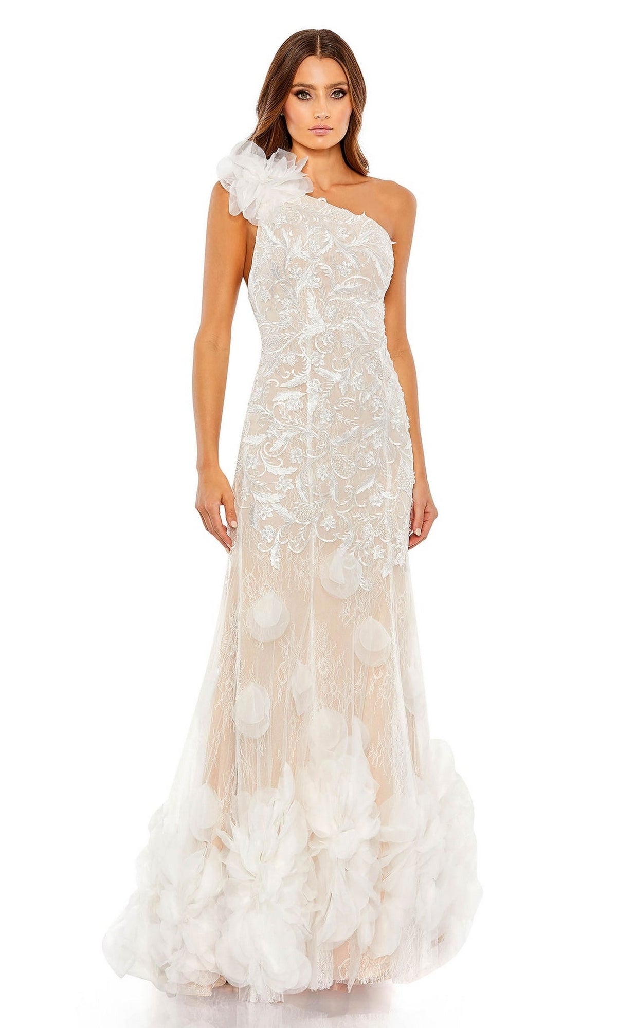A woman wears the Long Formal Dress 70131 by Mac Duggal, an ivory one-shoulder mermaid gown with ruffle floral accents and a sheer overlay.
