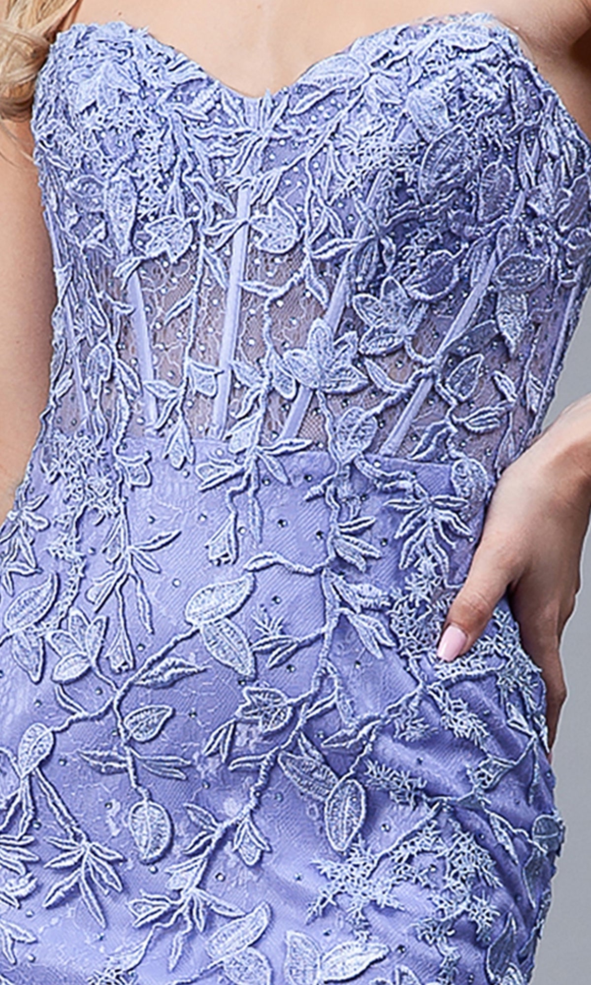 A close-up of a person wearing the Strapless Sweetheart Long Mermaid Prom Dress 7024, featuring a corset-style bodice with lavender lace, embroidered floral details, and sheer accents.