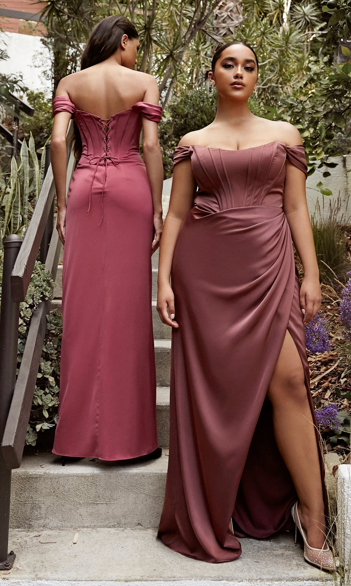 Two women wear the Corset Off-the-Shoulder Long Prom Dress 7484 in mauve—one shows the front with a thigh-high slit, while the other displays the elegant lace-up corset-bodice back on outdoor steps.
