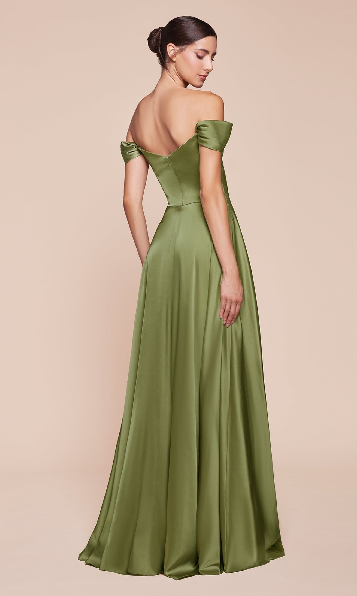 A woman with a low bun faces away, wearing the Ladivine 7493-1—an off-the-shoulder long prom dress in olive green satin.