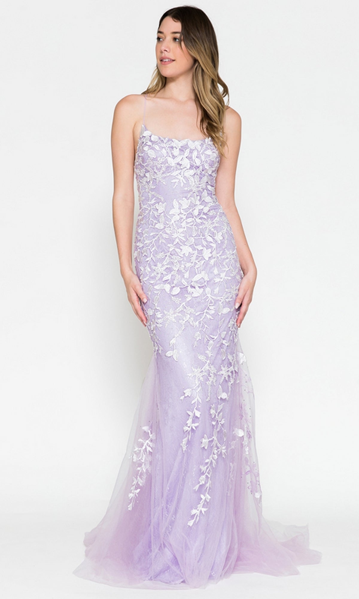 A woman poses against a plain white background in the Embroidered-Lace Tight Long Prom Gown 799, a sleeveless, floor-length lavender evening gown featuring floral lace embroidery.