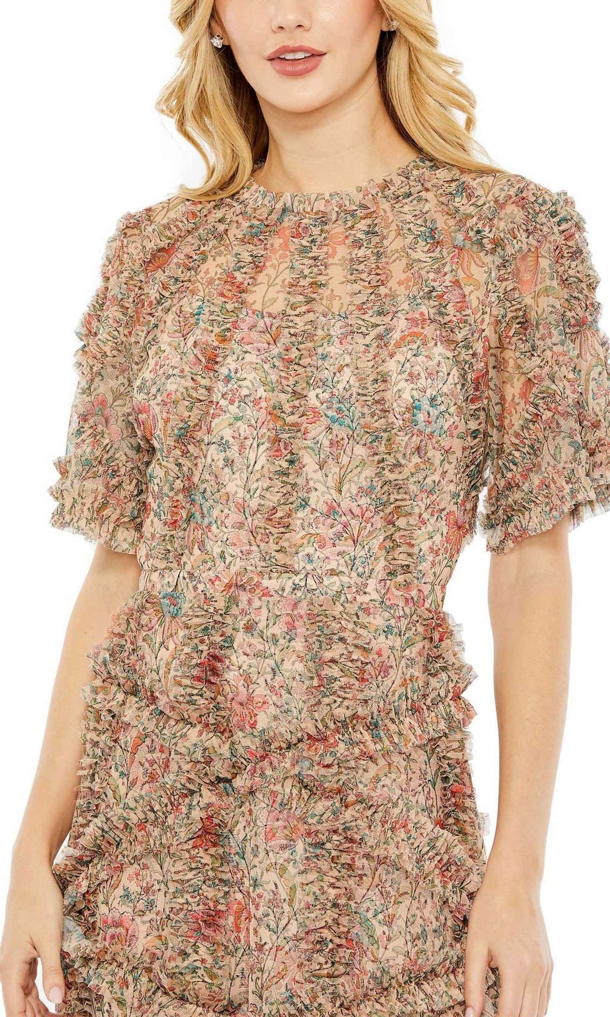 Woman in a Mac Duggal 8010 Short-Sleeve Wedding-Guest Dress featuring ruffle trim and sheer floral print in muted pink, green, and beige. Upper torso and partial face are visible.