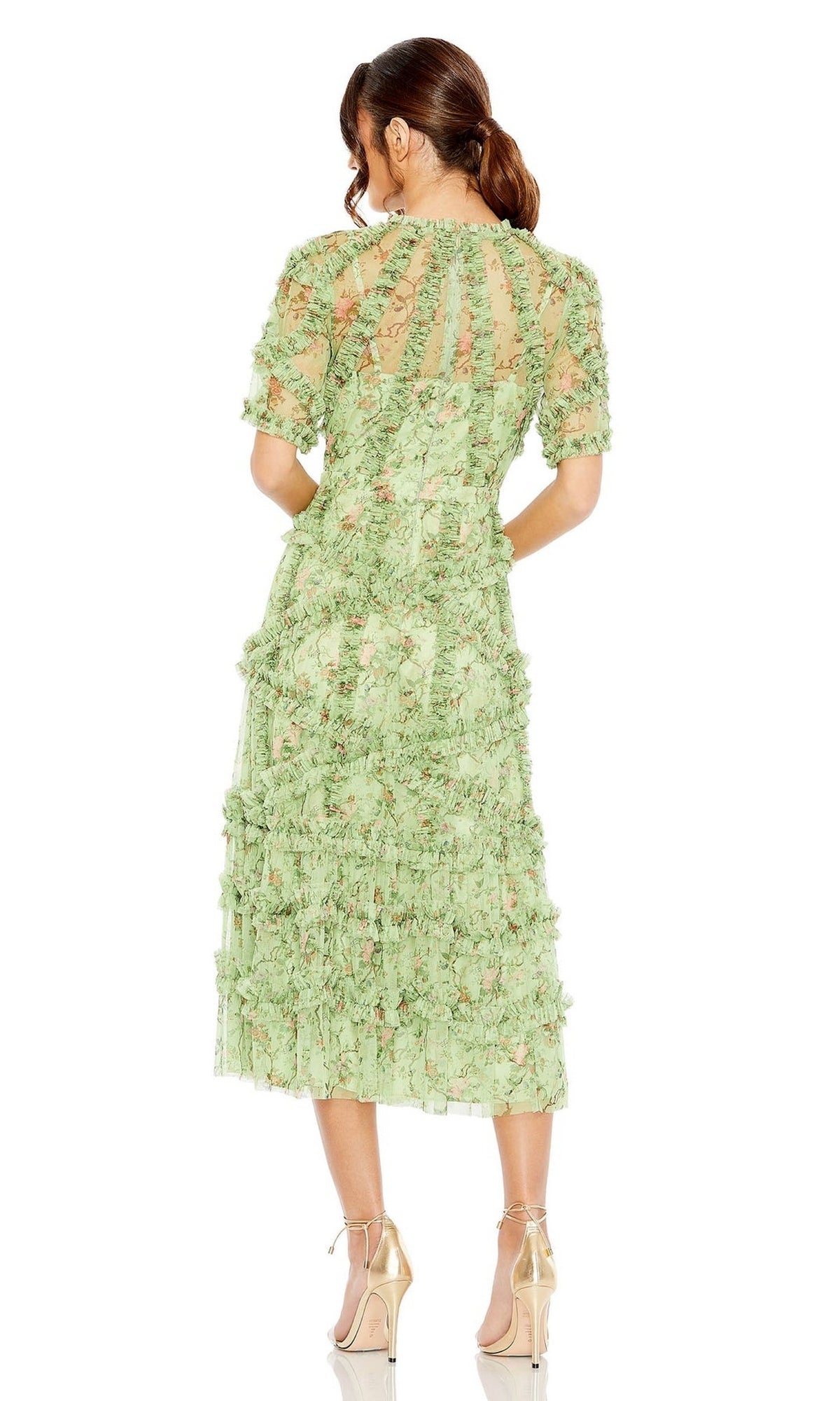 Woman faces away from camera, wearing a light green, textured, semi-sheer Mac Duggal 8010 short-sleeve wedding-guest dress and beige high heels.