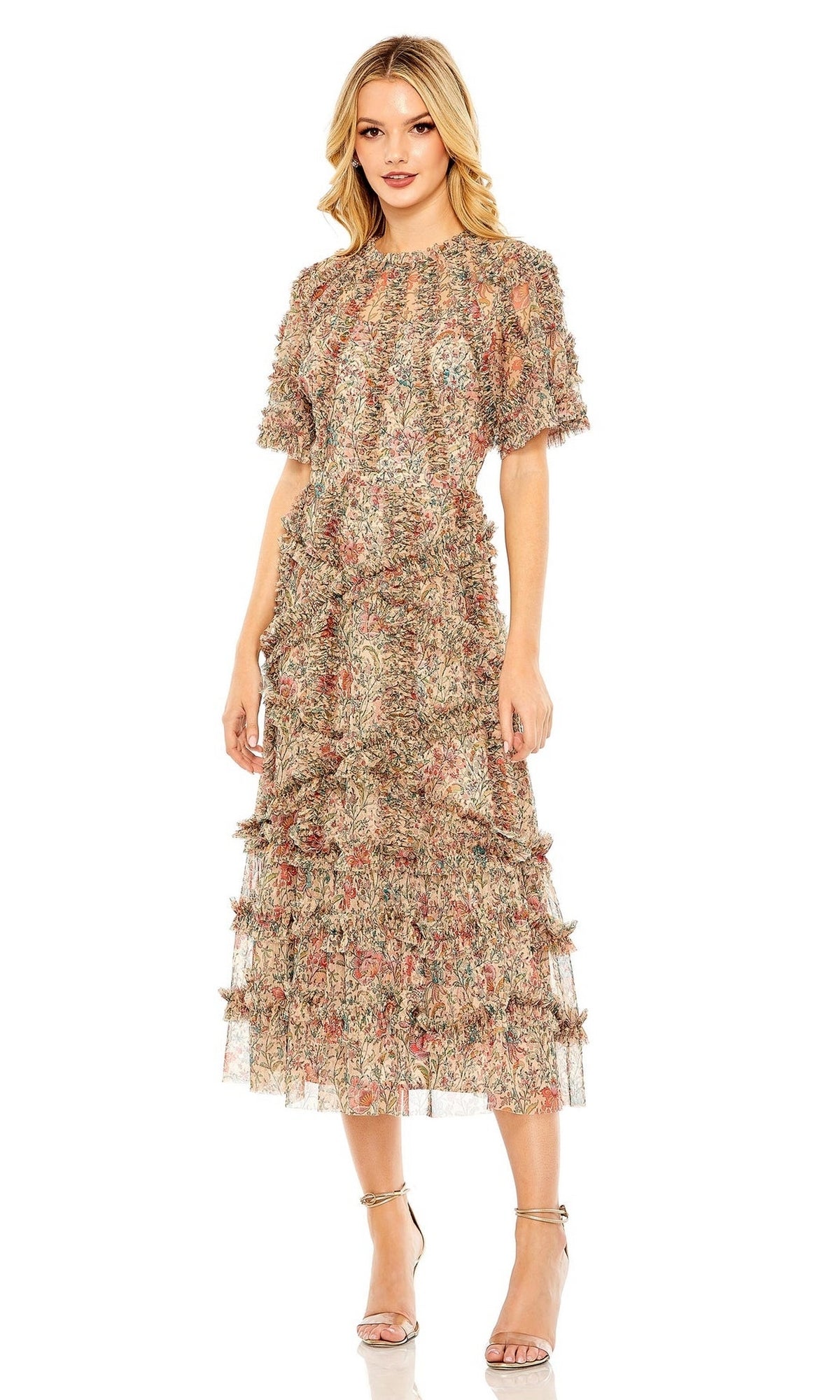 A woman wears the Mac Duggal 8010 short-sleeve wedding-guest dress with floral print, ruffle details, and ankle-grazing hem, styled with strappy high heels—an elegant tea-length look for any special occasion.