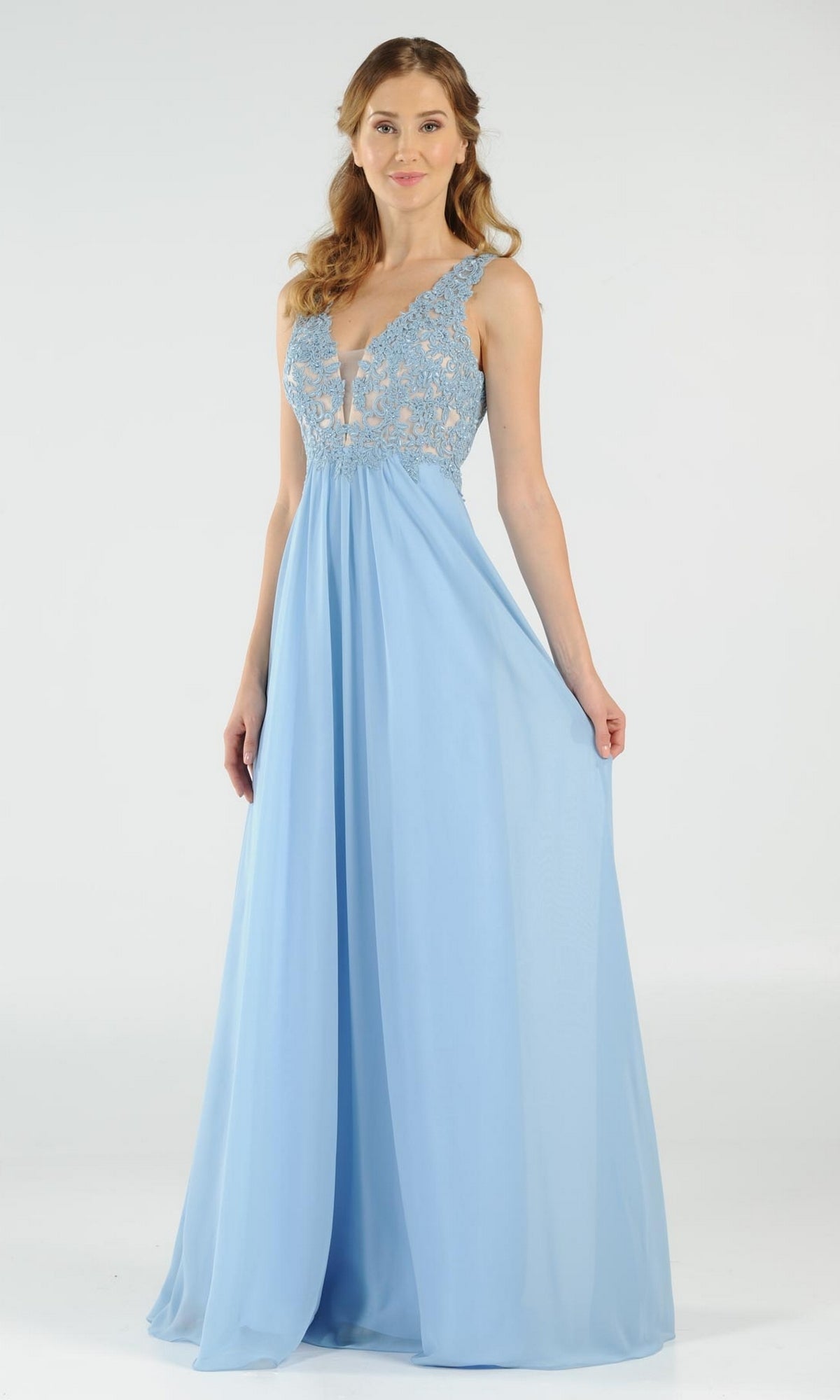 A woman in the Sleeveless V-Neck Chiffon Long Prom Dress 8012, featuring a lace bodice and floor-length skirt, stands against a plain white background.