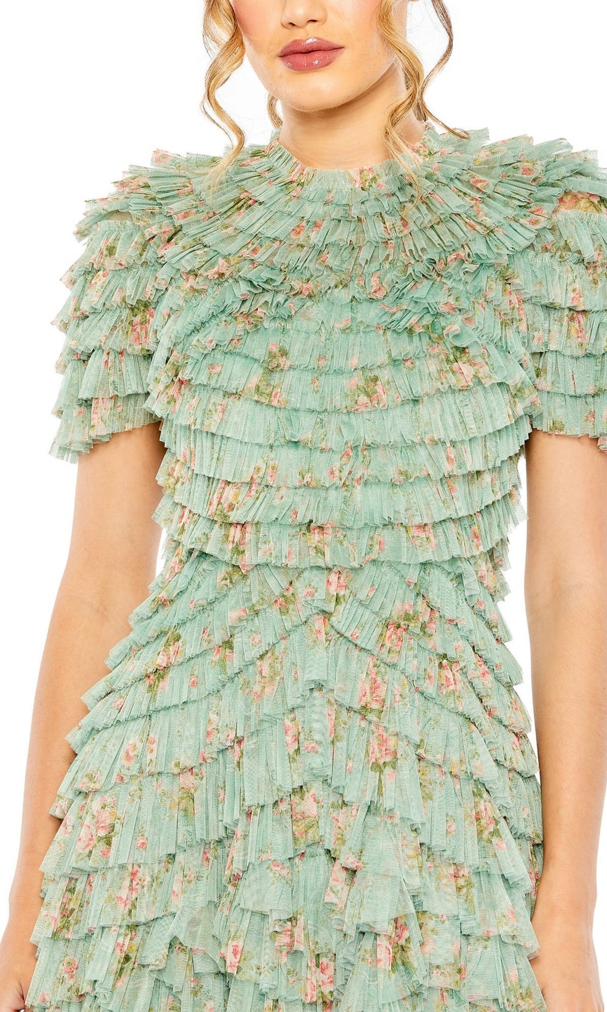 A woman in the Midi Wedding Guest Dress 8014 by Mac Duggal, a sage green floral semi-formal dress with layered, pleated ruffles on the shoulders, sleeves, and bodice.