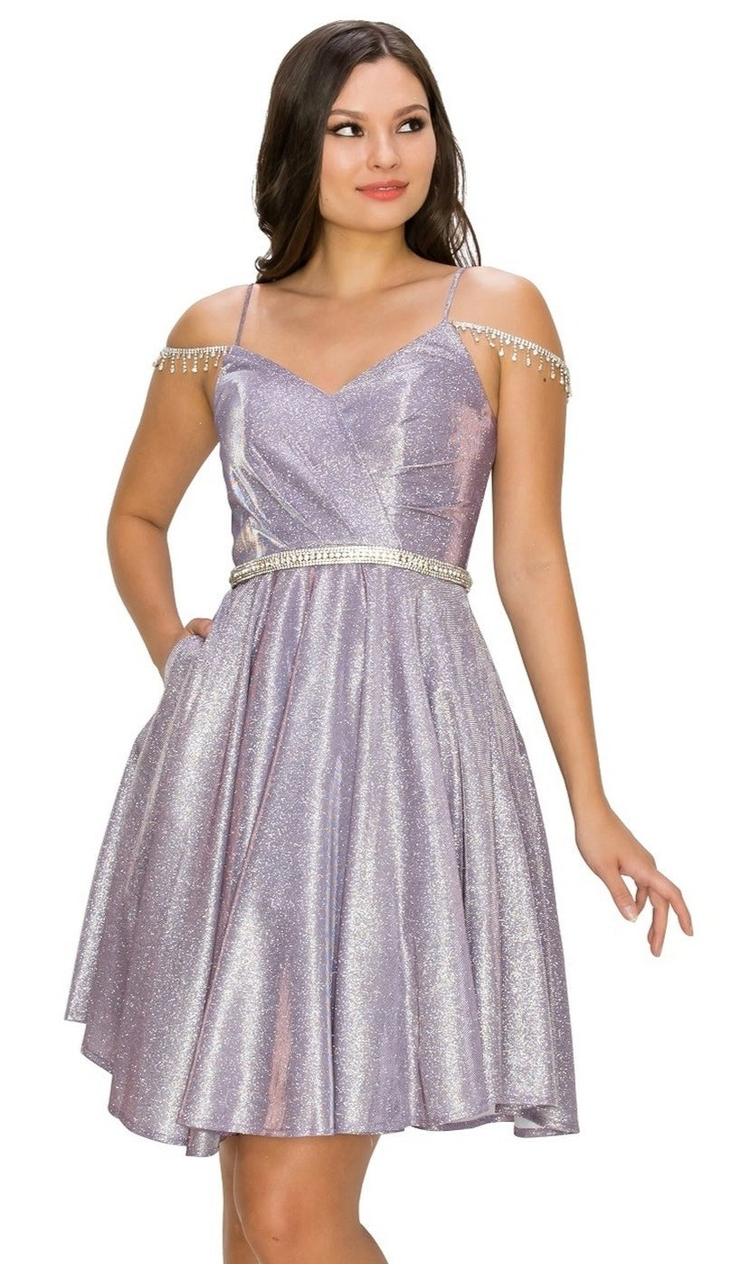 A woman stylishly poses in the Beaded Cold-Shoulder Short Homecoming Dress 8014J, a knee-length lavender semi-formal dress featuring thin straps, a jeweled waistline, and beaded shoulder accents.