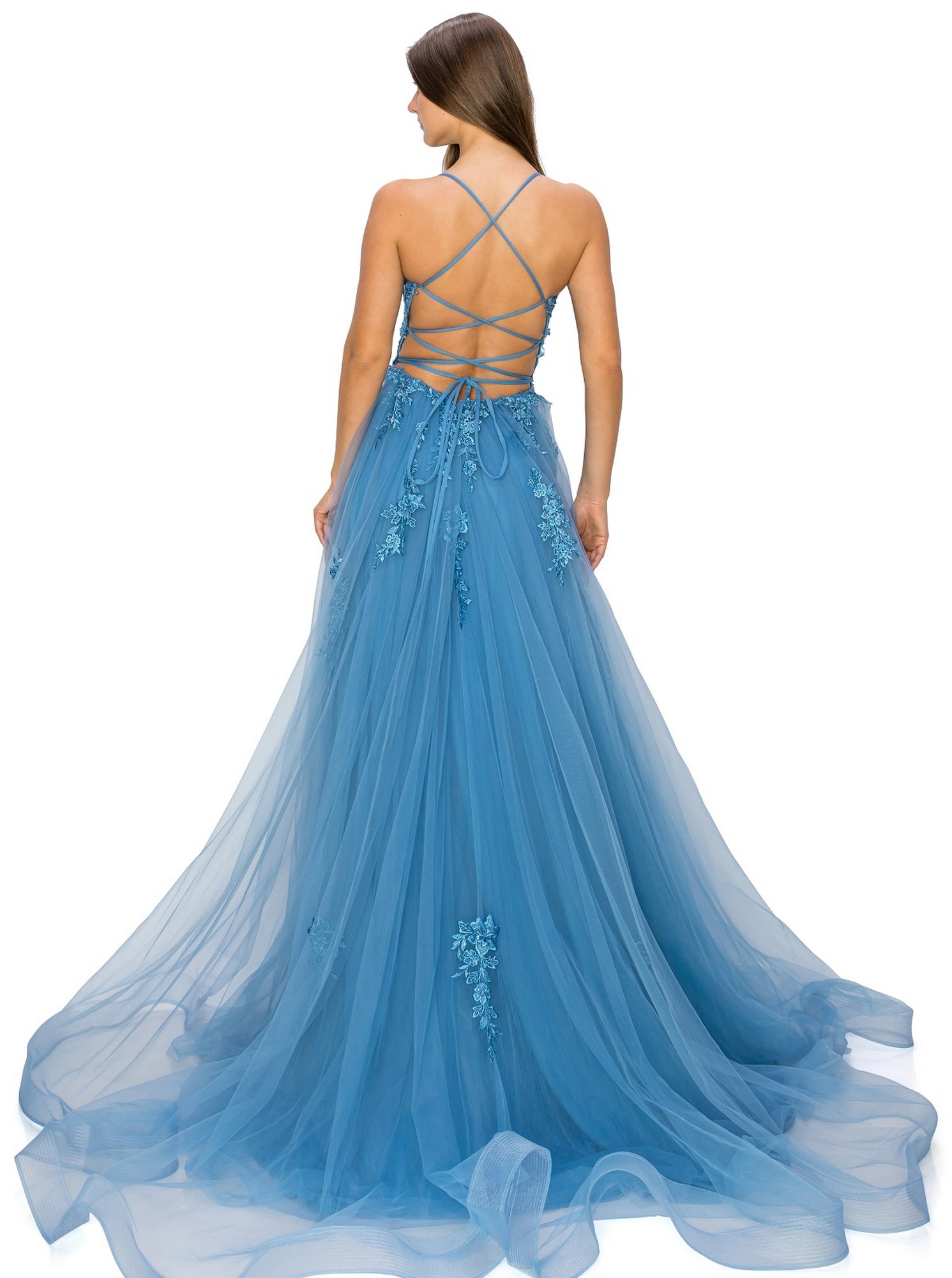 A woman stands with her back to the camera, wearing the Floral-Embroidered Long Tulle Prom Dress 8031J featuring blue tulle, delicate floral appliqué, and a strappy open back.