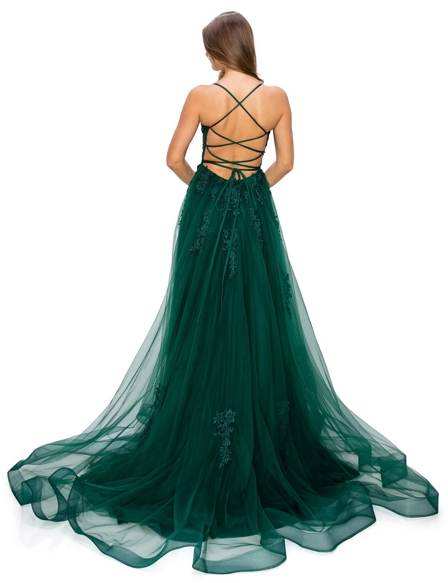 A woman stands facing away, wearing the Floral-Embroidered Long Tulle Prom Dress 8031J in deep green, featuring a layered skirt, crisscrossed open back, and delicate floral embroidery.