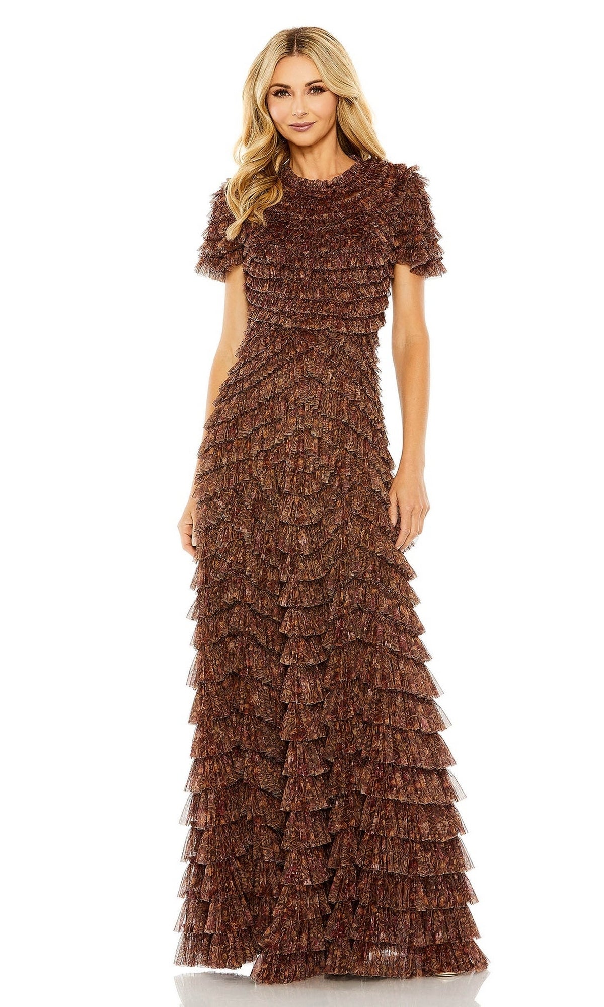 A woman stands against a white background wearing the Mac Duggal 8042, a long brown ruffled formal dress with short sleeves and layered metallic tiers.
