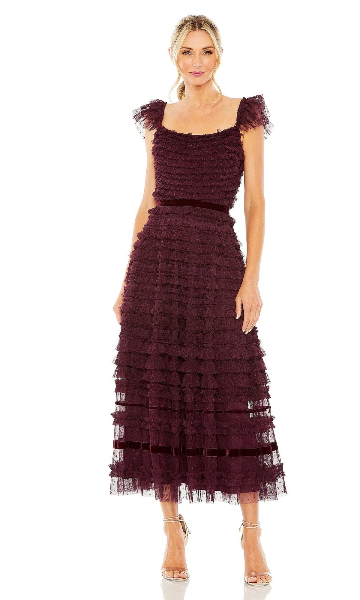 Woman in the Mac Duggal 8054 Midi Wedding Guest Dress—sleeveless, burgundy, ruffled with a fitted waist and ankle-length hem—paired with clear heeled sandals.