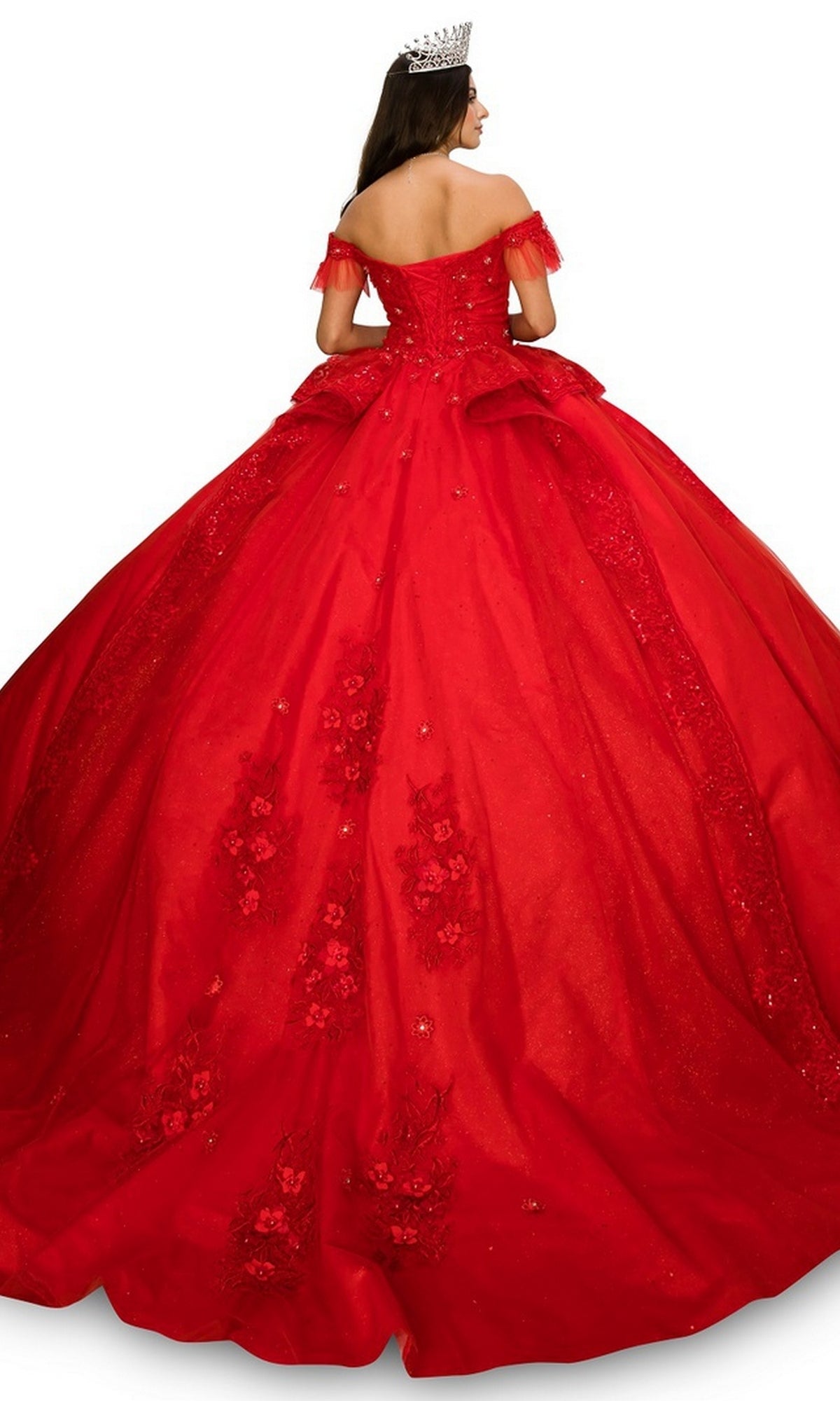 A woman stands facing away, showcasing the ornate train, lace embroidery, and floral details of the Quinceanera Dress 8055J By Cinderella Couture—a red off-the-shoulder ball gown with a sweetheart neckline and silver crown.