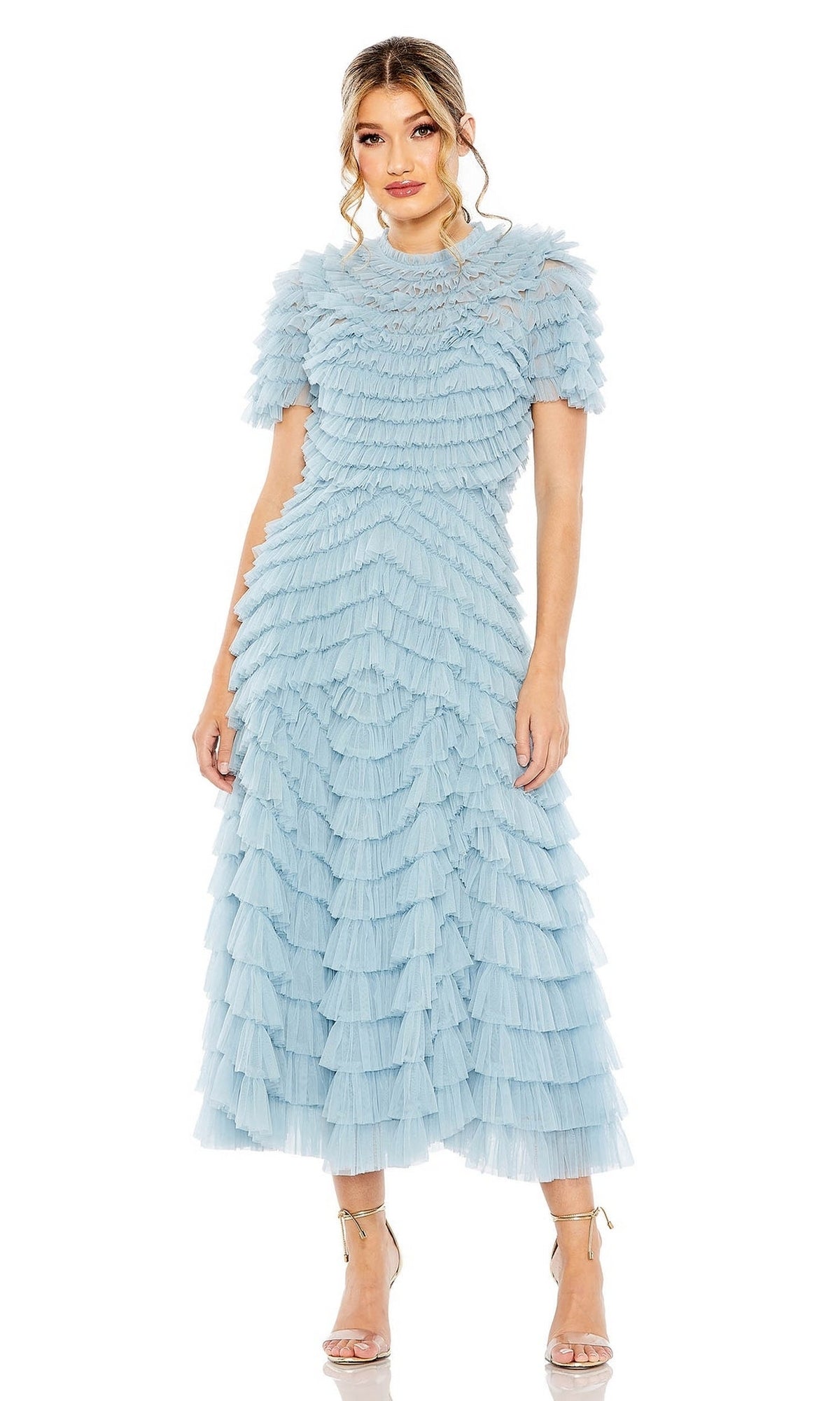 A woman wears the Midi Wedding Guest Dress 8055 by Mac Duggal—a light blue, short-sleeved, tiered ruffle midi dress with ankle-strap heels—making it a perfect pastel option for wedding guests.
