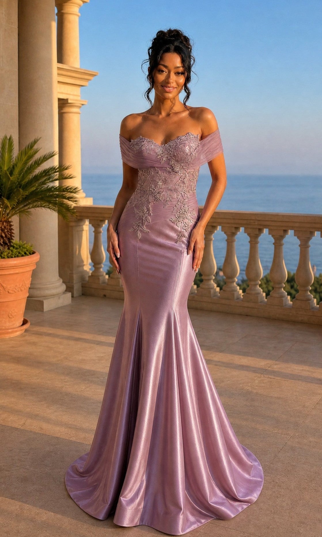 A woman wearing the Long Prom Dress Amelia Couture 8074 in Victorian Purple, featuring beaded appliqué and floral embroidery, stands on a terrace with columns, a potted plant, and an ocean view behind her.