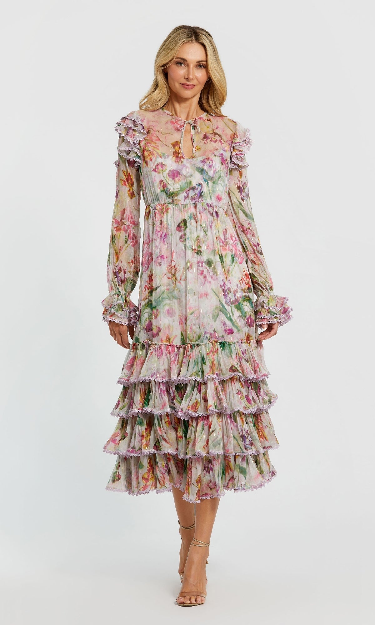 A woman wears the Midi Print Wedding Guest Dress: Mac Duggal 8102, featuring long sleeves, ruffled layers, and a midi skirt, standing facing forward against a plain white background.