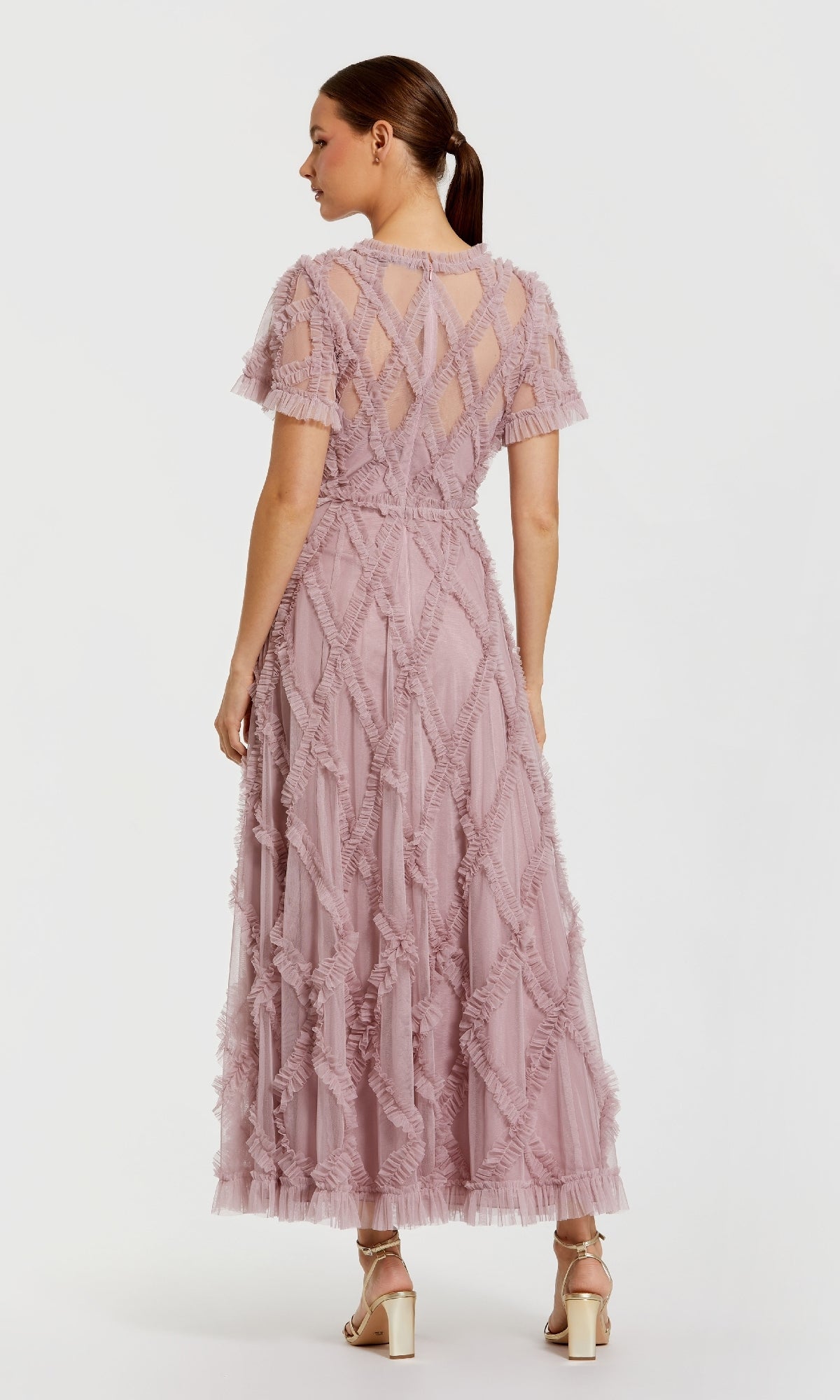 Woman wearing a pink dress on a white background