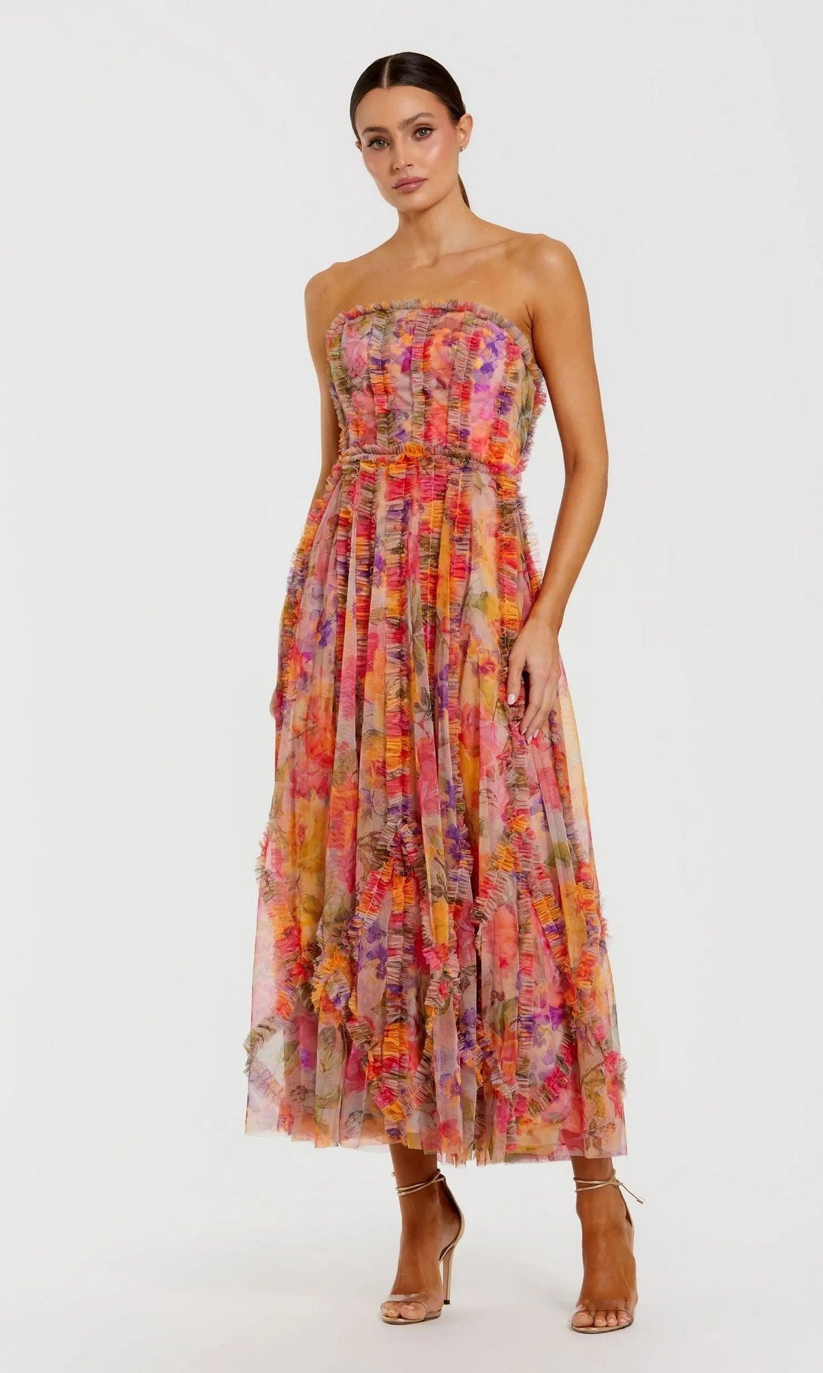 Woman in a Mac Duggal 8308 Strapless Print Midi Party Dress in Multi, standing against a white background and wearing heeled sandals.