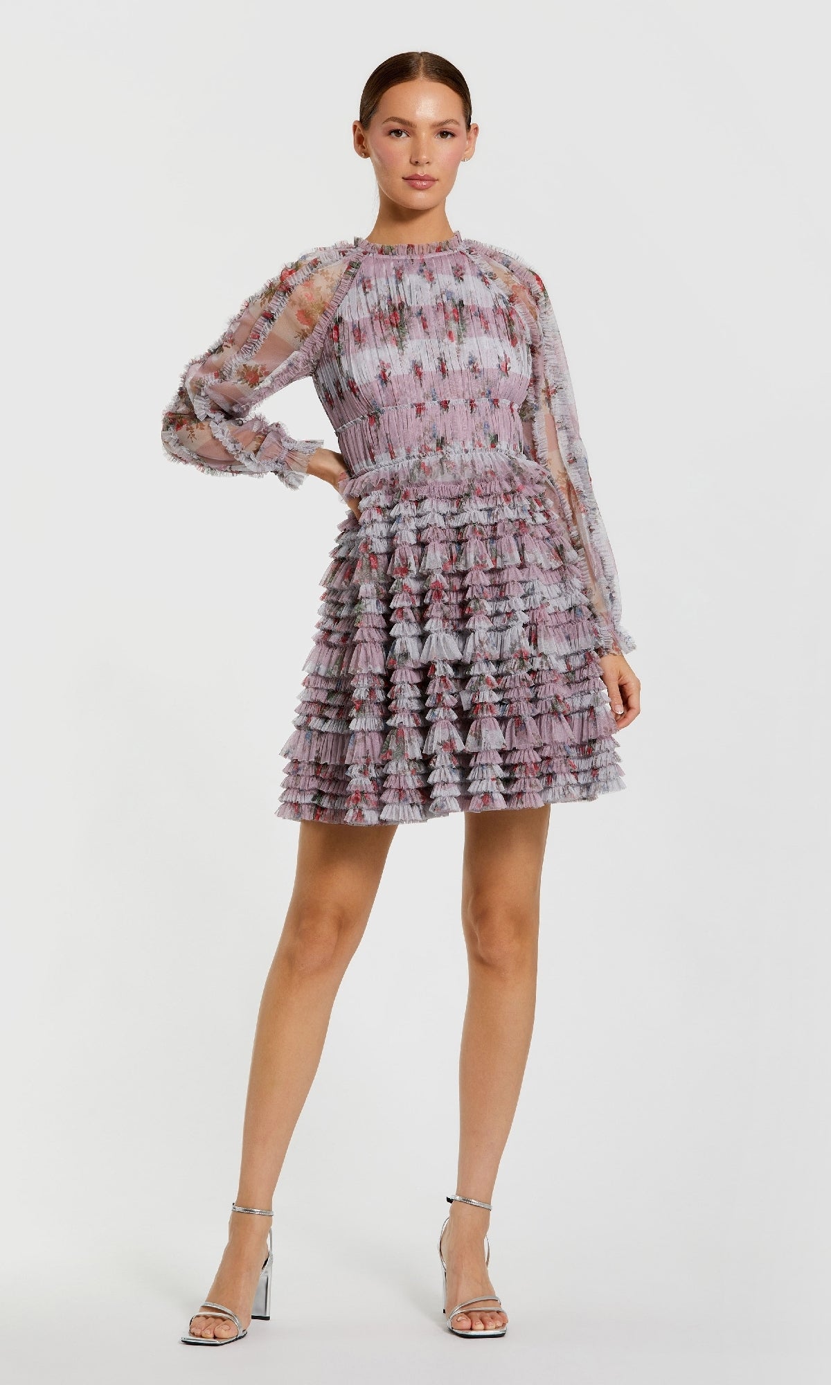 Woman wearing a patterned dress on a white background