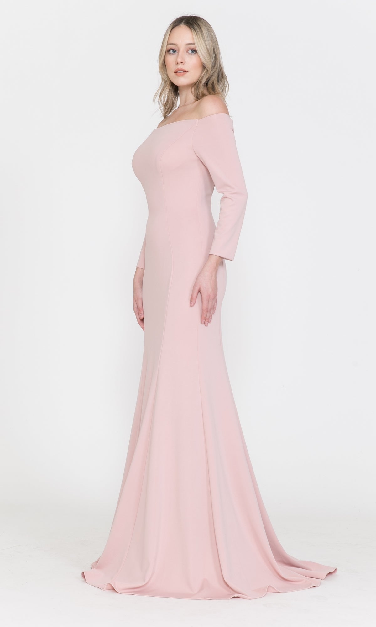A woman models the Off-the-Shoulder Long-Sleeve Formal Prom Dress 8378, a fitted, floor-length gown in light pink, against a plain white background.