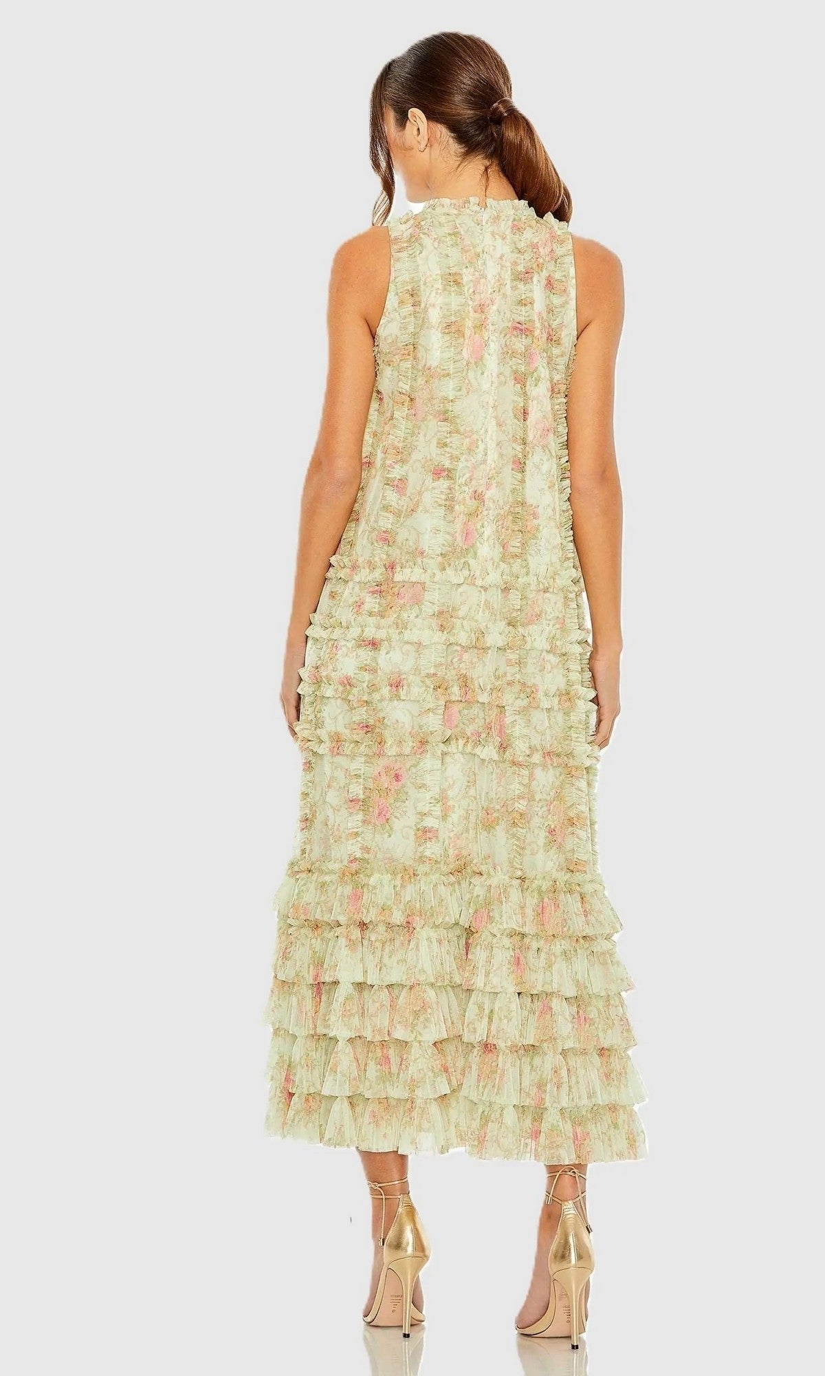 Wearing the Midi Party Dress: Mac Duggal 8484, a woman is seen from behind in a sleeveless, light green midi dress featuring an ankle-length hem, delicate tiered ruffles, and a subtle floral pattern. Her hair is tied back and she pairs the look with nude high heels—a graceful choice for any cocktail occasion.