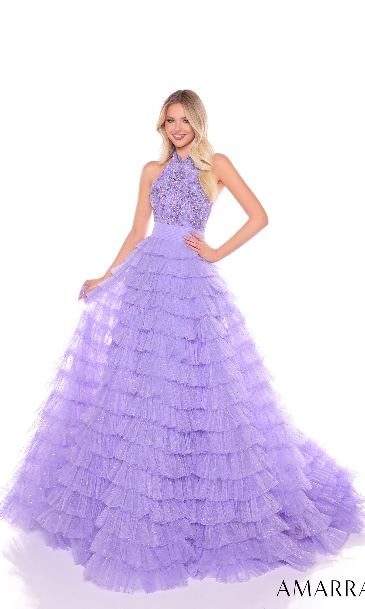A woman models the Long Formal Dress 88102 by Amarra?a sleeveless, lavender A-line gown with a lace bodice and tiered tulle skirt?against a white background.