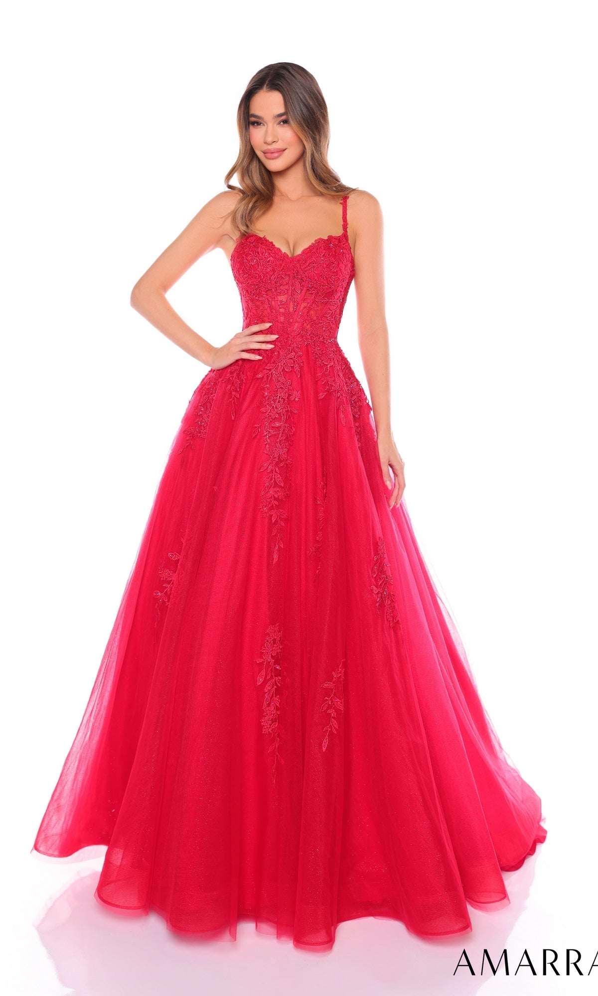 A woman wears the Long Formal Dress 88109 by Amarra, a bright red floor-length A-line gown with lace and tulle details, a fitted sheer corset bodice, and thin straps.