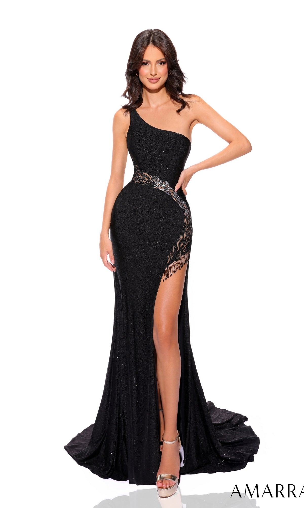 A woman poses against a white background wearing the Amarra One-Shoulder Cut-Out Long Prom Dress 88791, featuring a fitted silhouette, high slit, beaded-lace cut-out detailing, and silver high heels.