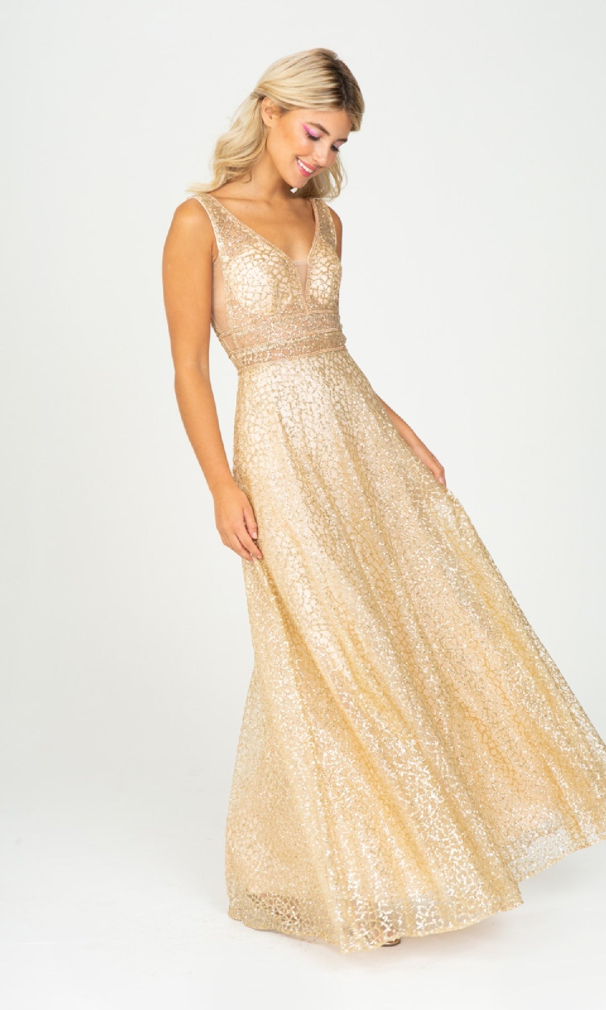 A woman models the Eureka 9005, a sleeveless long glitter formal dress with a fitted bodice and flared skirt in gold sequins, standing against a plain white background.
