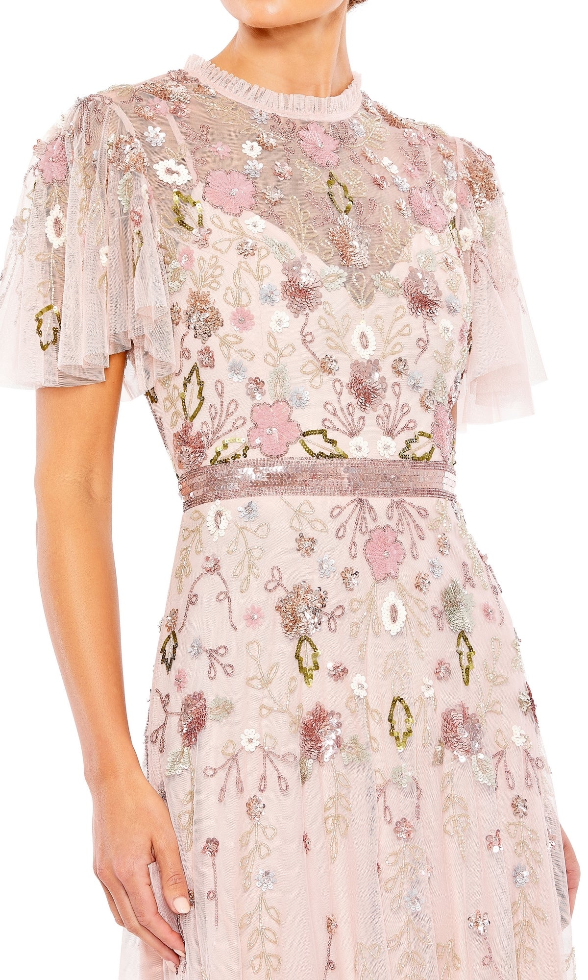 A woman wearing the Long Formal Dress 9136 by Mac Duggal, a light pink, short sleeve gown featuring a sheer sweetheart neckline and pastel floral embroidery.