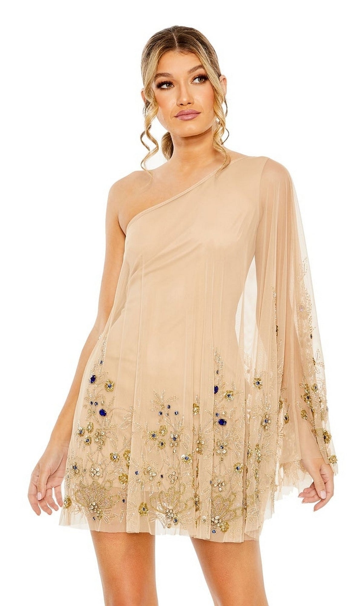 A woman wears the Short Homecoming Dress 9231 by Mac Duggal, a nude one-shoulder mini dress with sheer fabric and delicate floral beading on the skirt and sleeve.