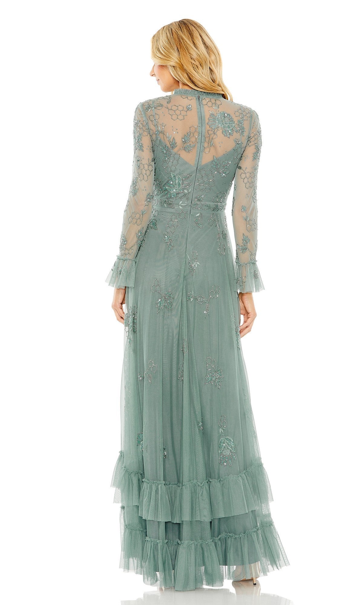 A woman is shown from the back against a white background wearing the Mac Duggal 9249 Long Formal Dress, a sheer, light green gown featuring beaded floral embellishments and ruffled sleeves.