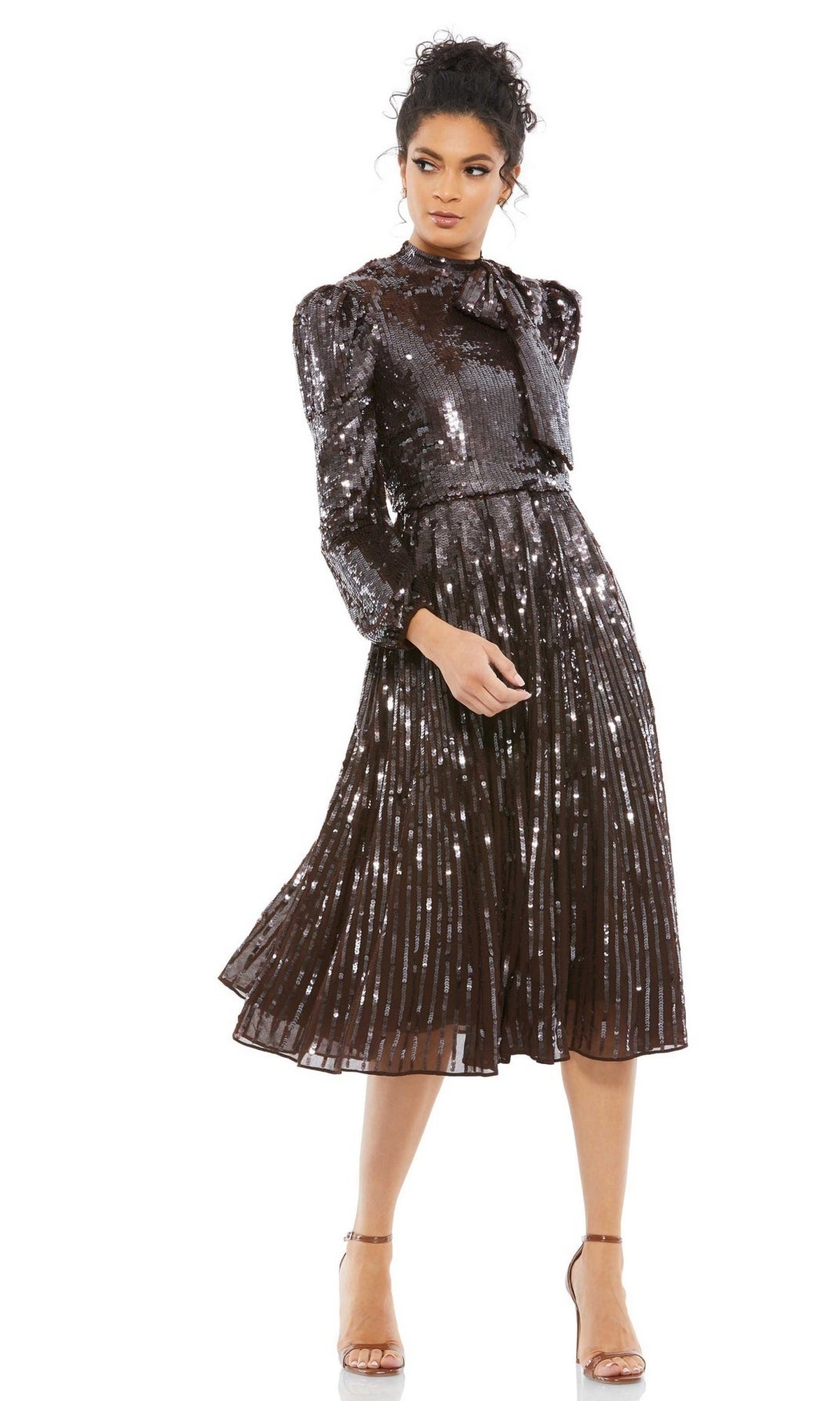 A woman wearing the Brown Midi Wedding Guest Dress: Mac Duggal 93642—a long sleeve midi dress—paired with nude high-heeled sandals.