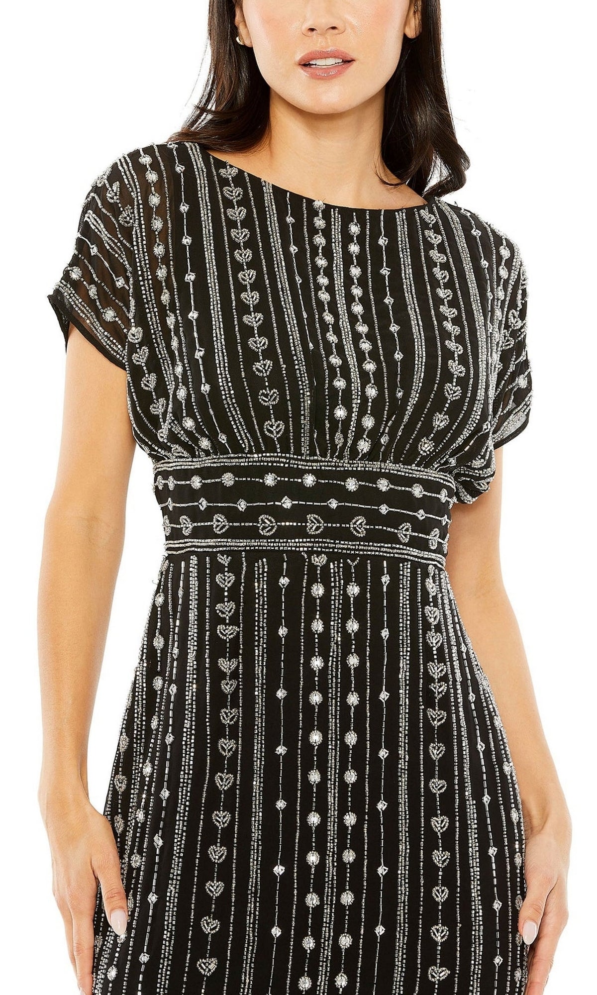 A woman wears the Mac Duggal Beaded Short Wedding-Guest Dress 93649, a black short-sleeve dress adorned with white vertical heart and dot designs.