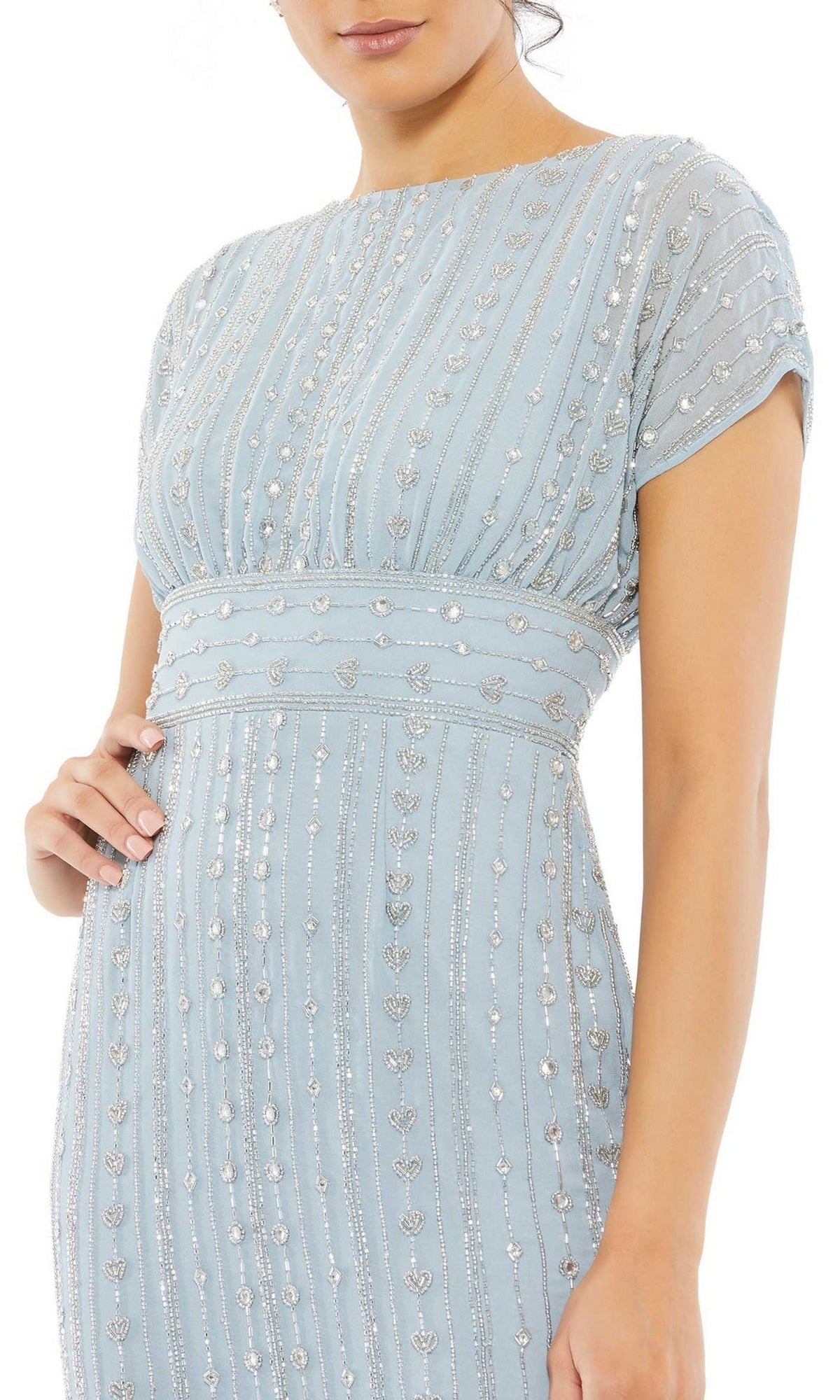 Woman wearing the Mac Duggal Beaded Short Wedding-Guest Dress 93649 in light blue, featuring silver vertical stripes and floral patterns, shown from shoulders to knees.