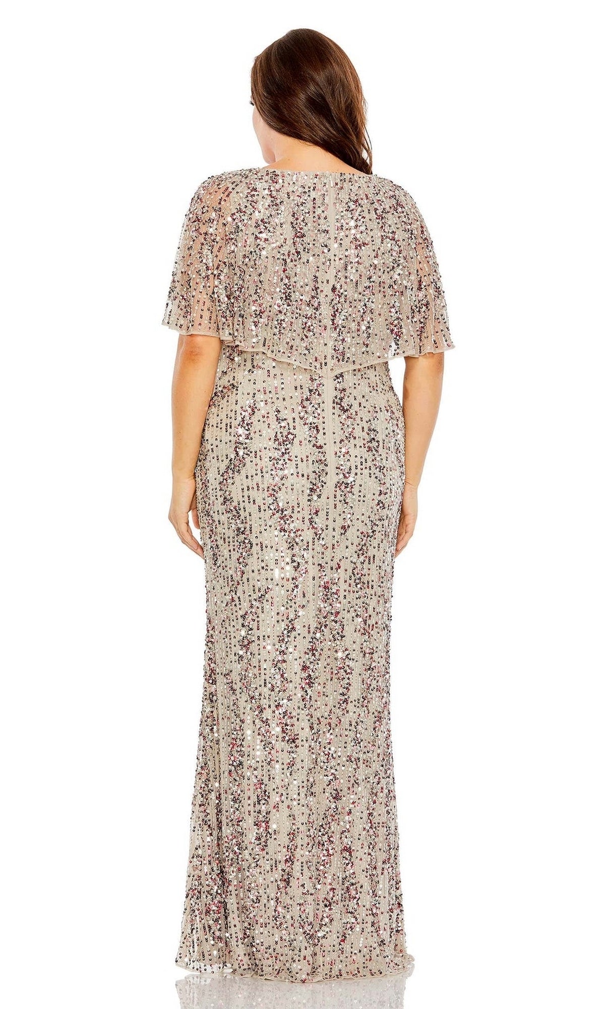 A woman shown from the back wears the Mac Duggal 93867 plus-size long sequin prom dress, a floor-length, short-sleeved gown in light beige with purple and silver embellishments.