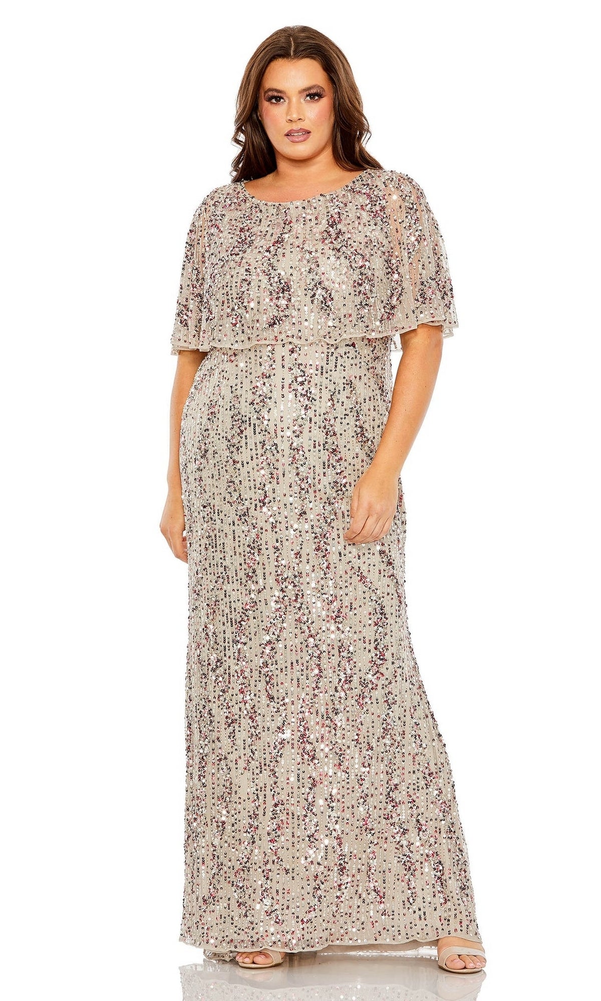 A woman wearing the Plus-Size Long Sequin Prom Dress (Mac Duggal 93867), a floor-length, short-sleeve evening gown adorned with sparkling sequins, stands facing forward against a white background.