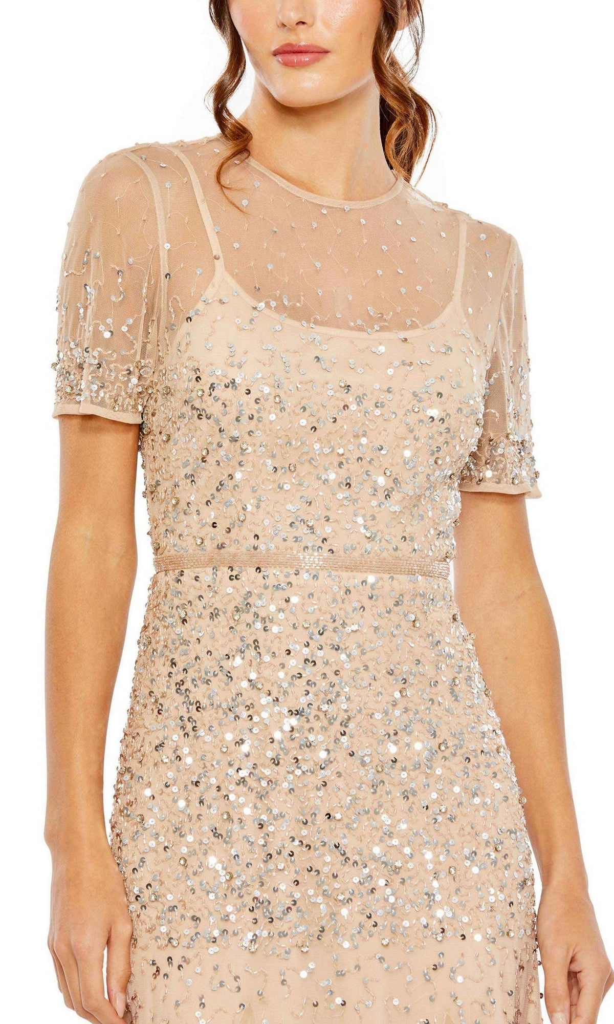 Woman in the Mac Duggal Sheer High-Neck Sequin Formal Dress 93909, featuring short sleeves, a nude sheer overlay, beaded waist, and silver sequins with embellishments.