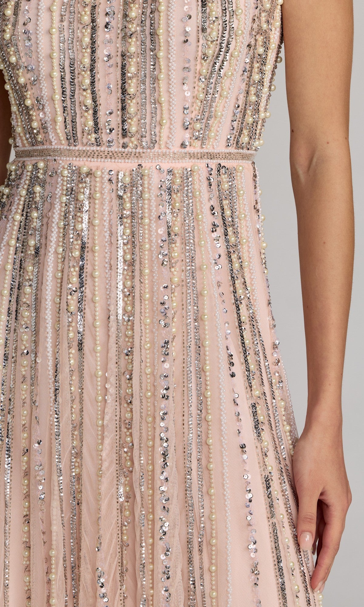 A close-up shows the Long Beaded Blue Formal Dress: Mac Duggal 94080, featuring vertical rows of beads, sequins, and pearls in powder blue; a person's right arm appears at the side.