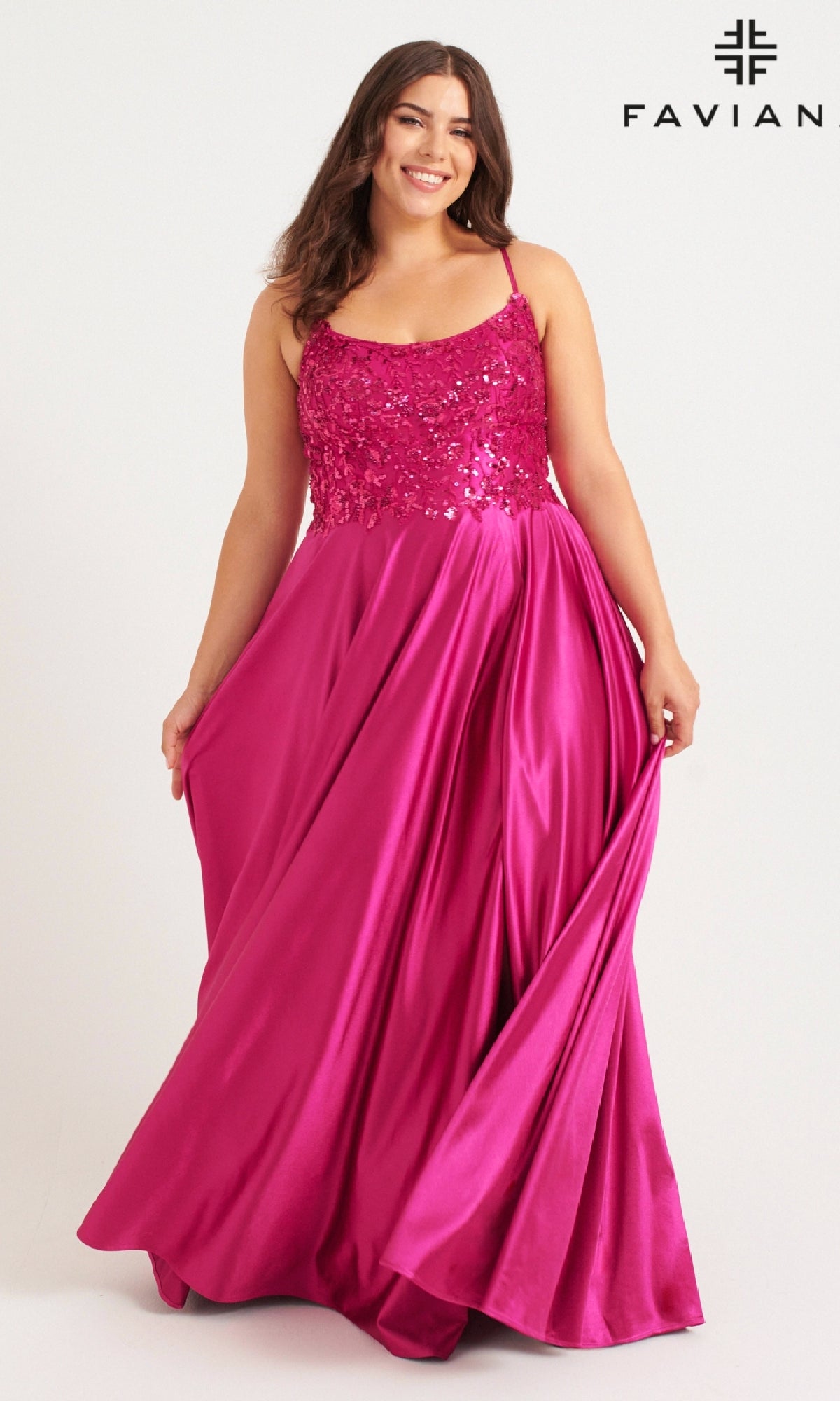 A woman models the Faviana 9582, a long plus-size prom dress in bright pink with a beaded bodice and flowing satin skirt, against a white background. The Faviana logo is displayed in the top right corner.
